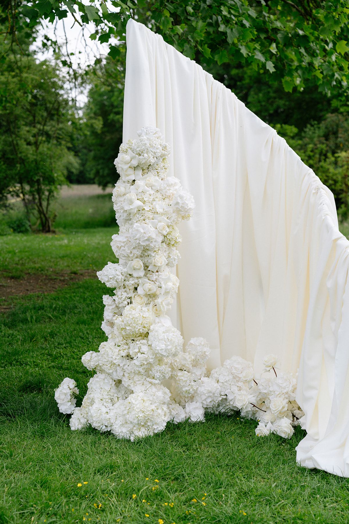 Detail of the white floral draping on the ceremony arch