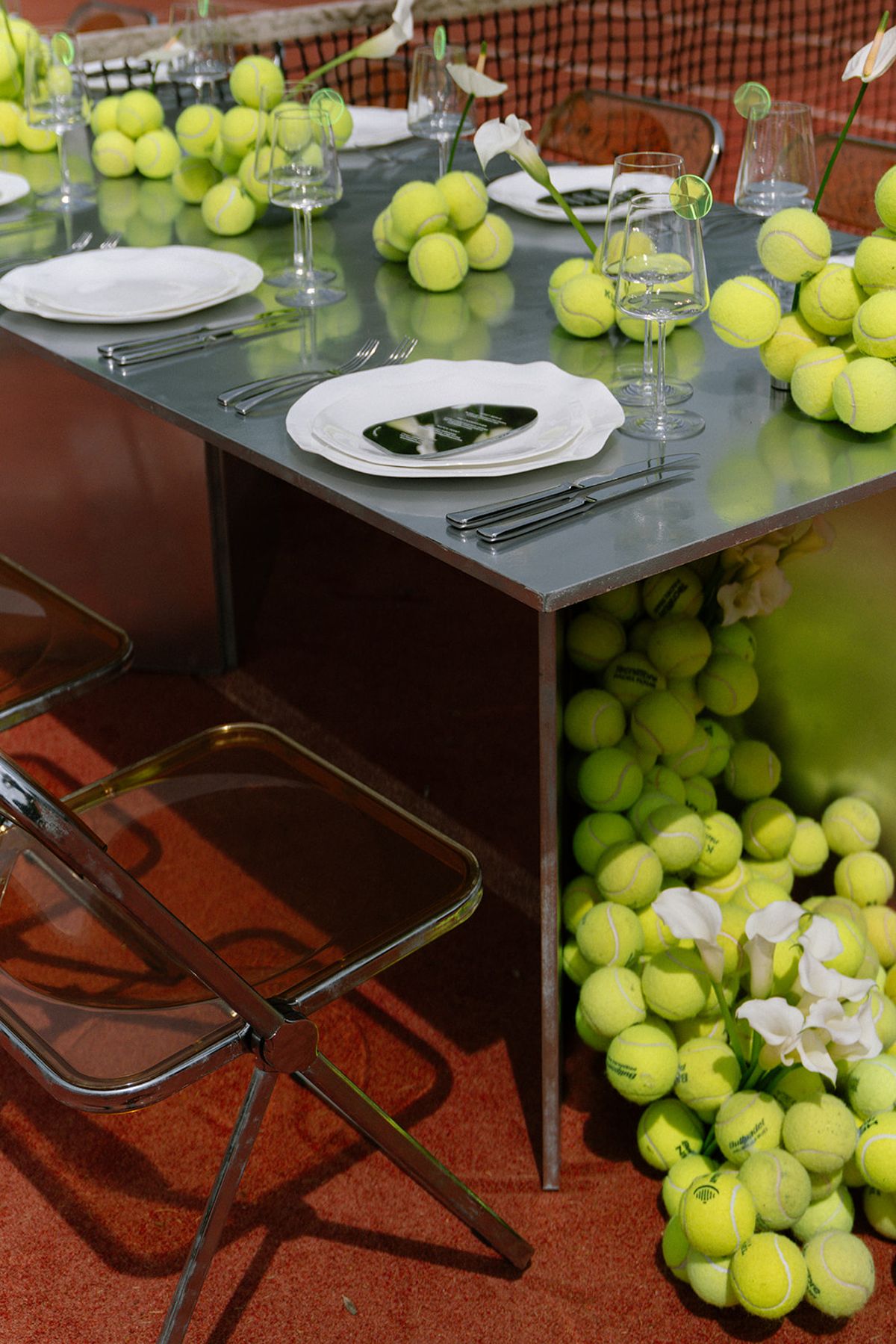 Bar cart detail with tennis balls and wine glasses