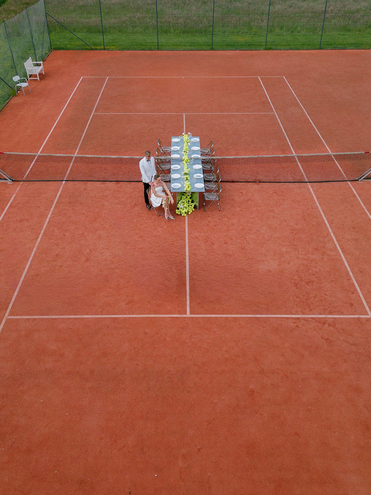 Aerial view of the tennis court set with a long reception table
