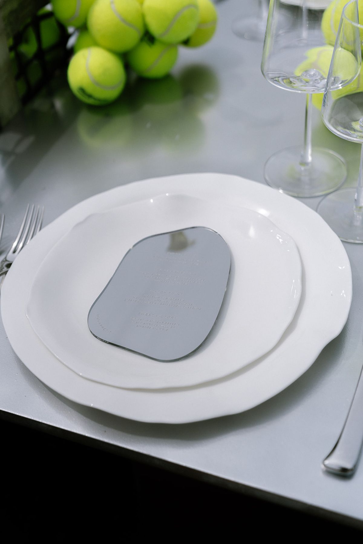 Place setting detail with cutlery and a folded napkin