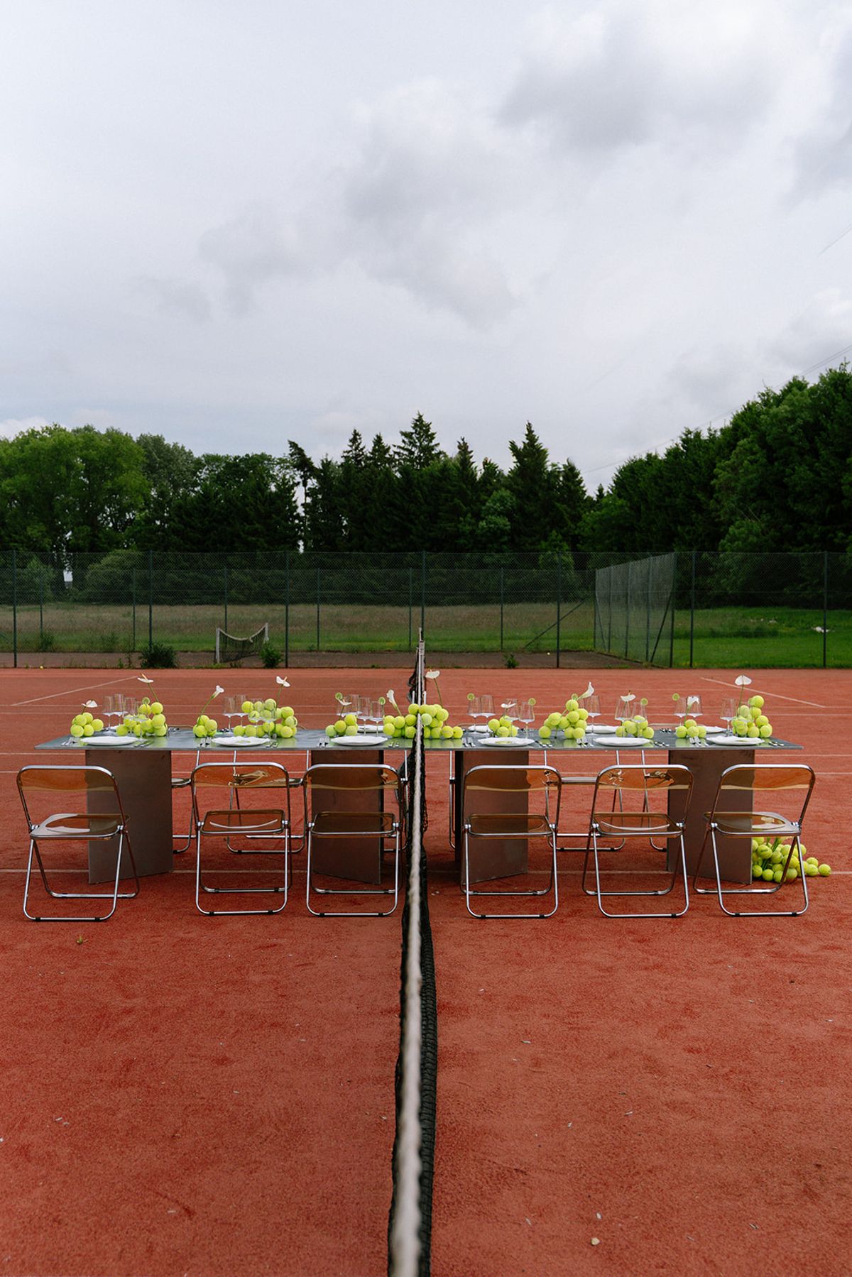 Aerial view of the reception table set across the tennis court