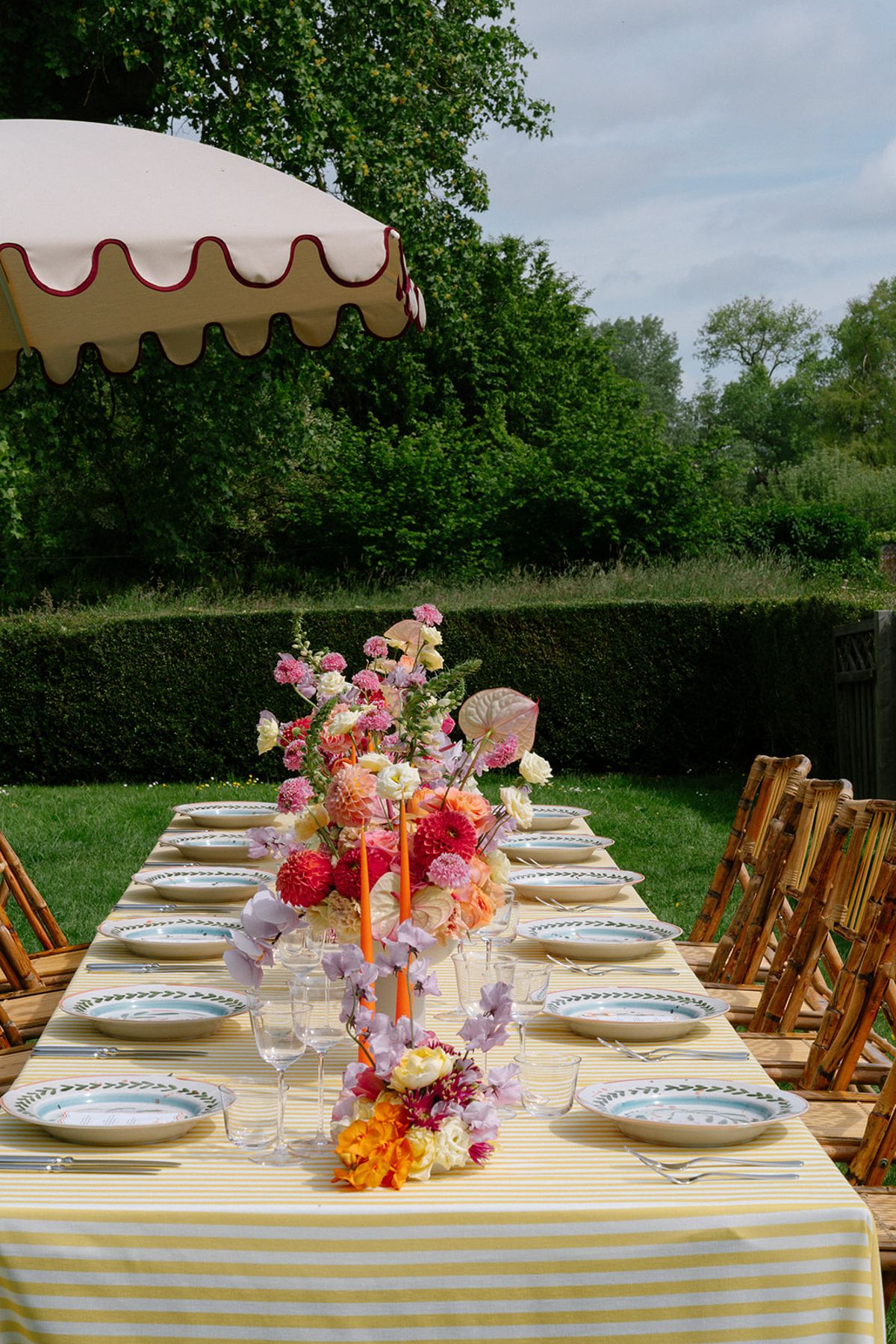 Place setting detail with patterned plates and tennis-ball green accents