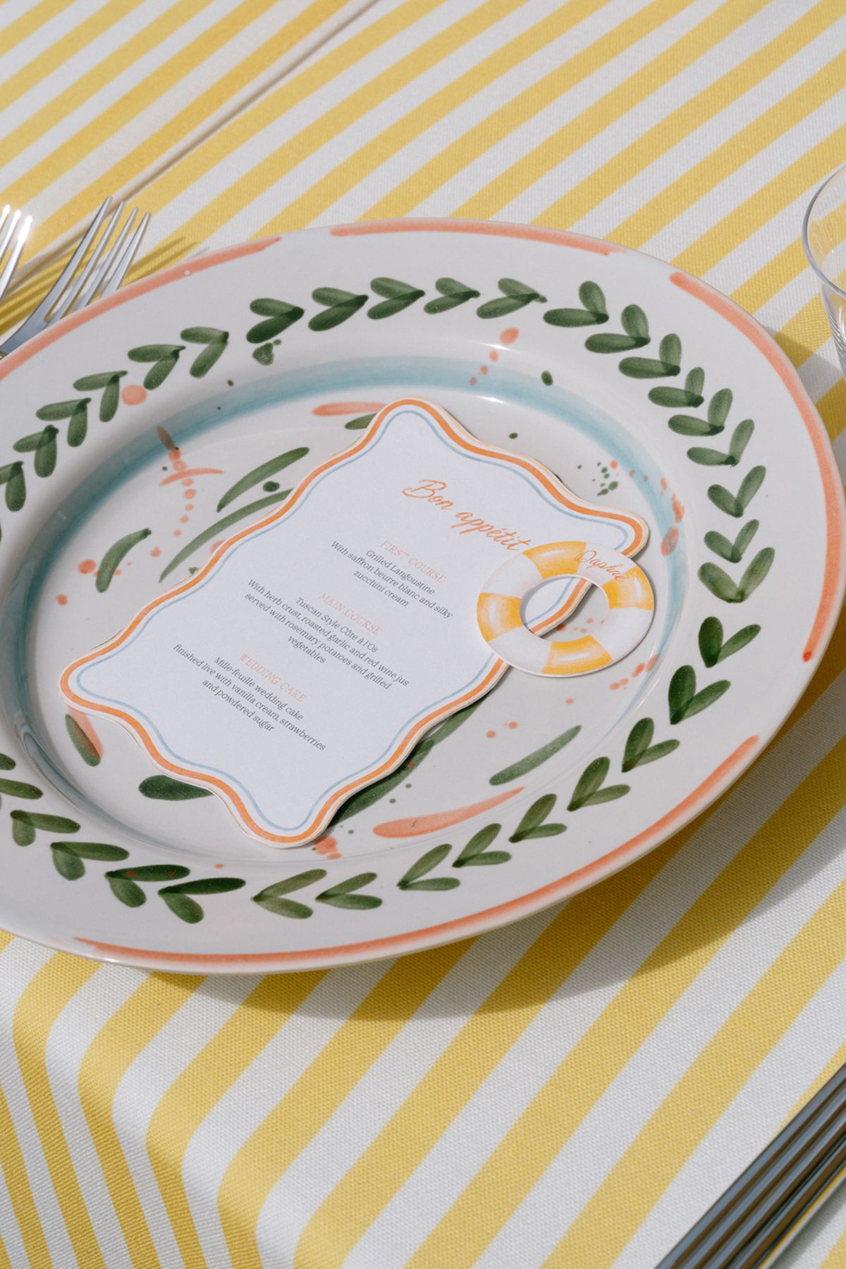 Hand-painted menu card on a patterned plate