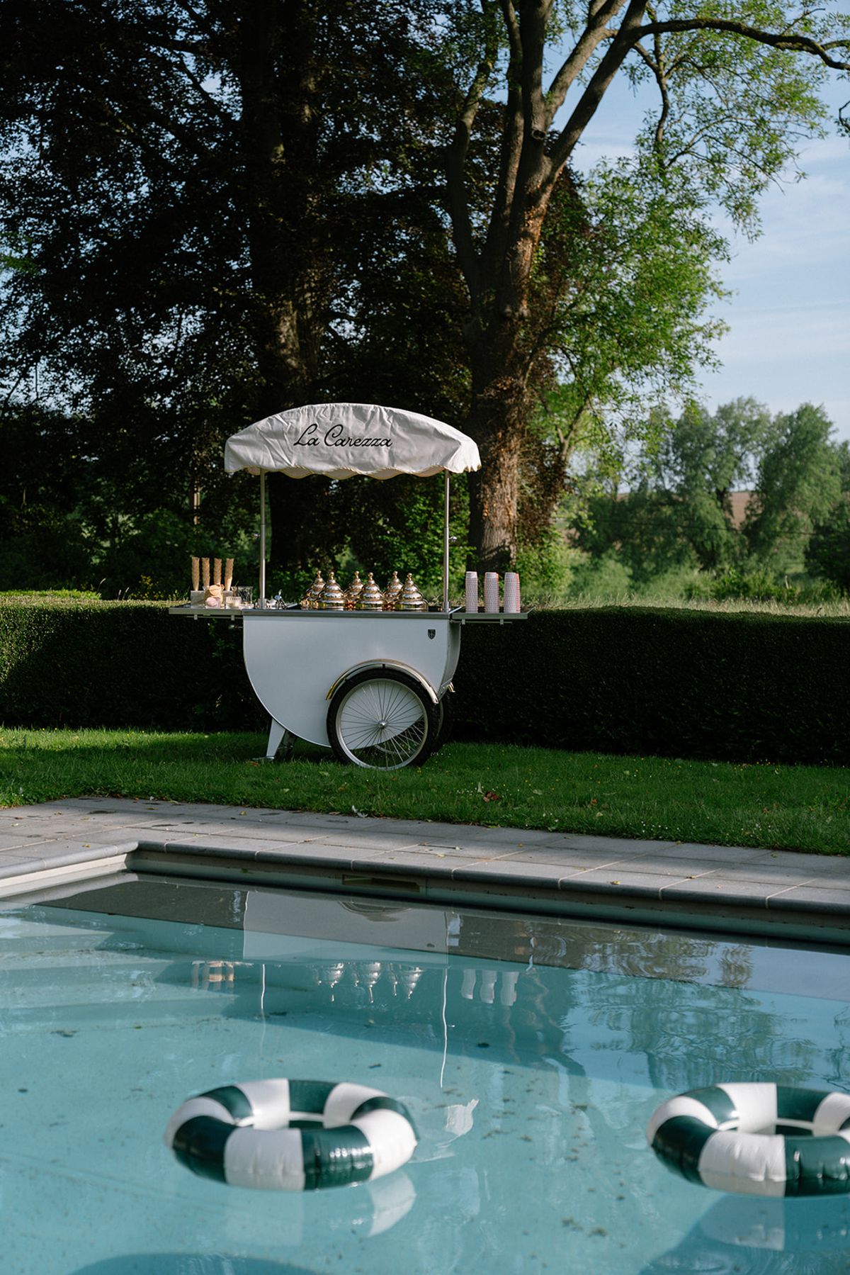 The 'La Carezza' ice cream cart beside the pool