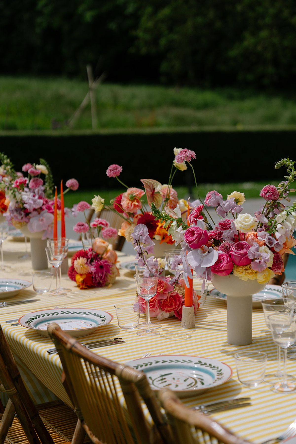 Poolside floral arrangement in pink and coral tones