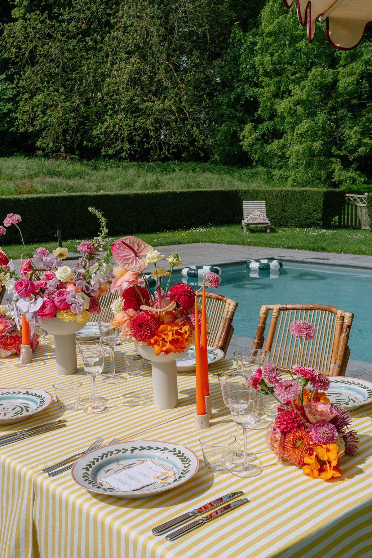 Poolside table setting with pink and orange florals