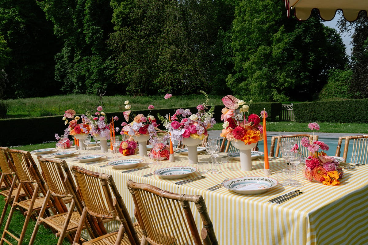 Long table set for the reception in the garden