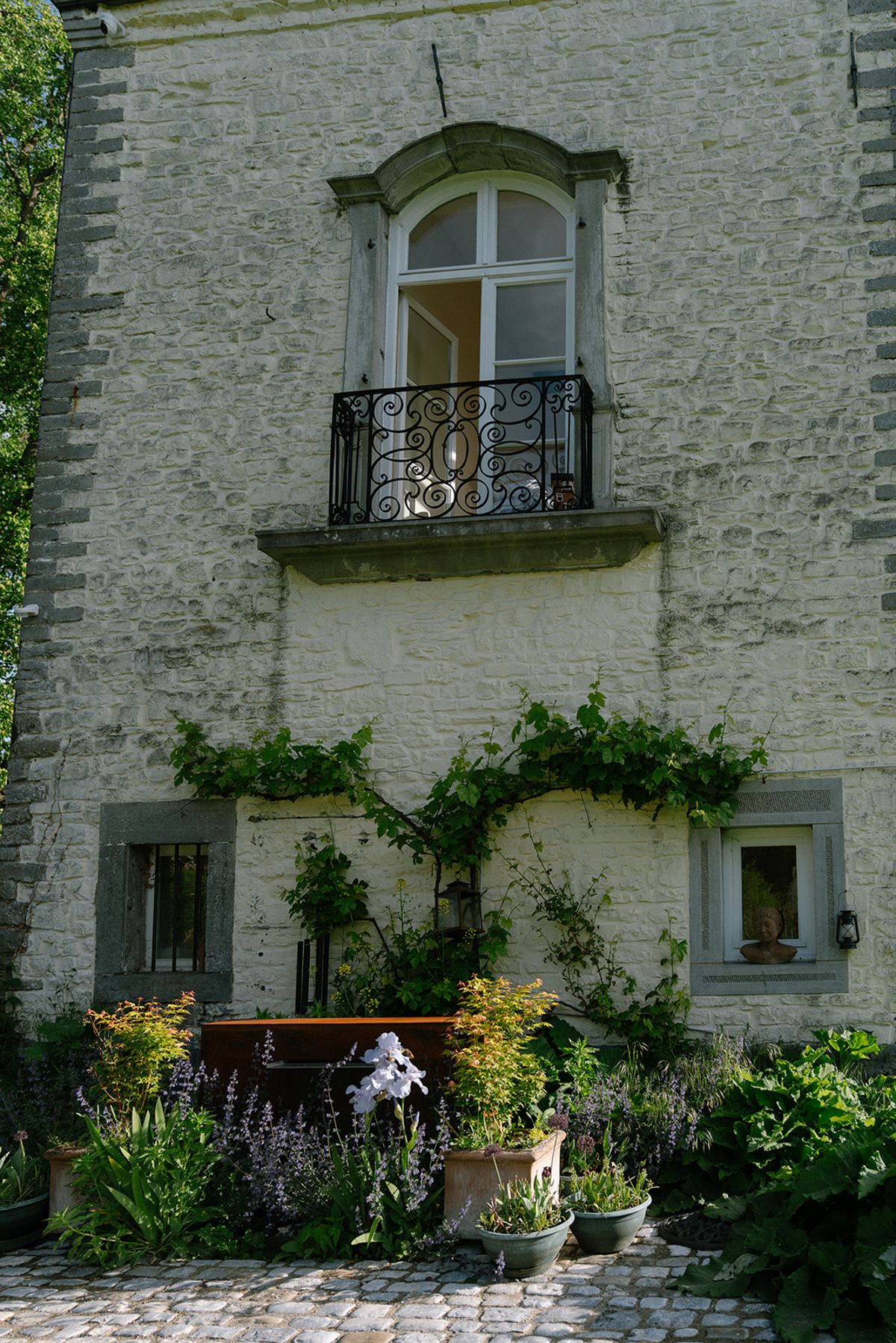 Exterior of Chateau d'Emines with ivy climbing the stone facade