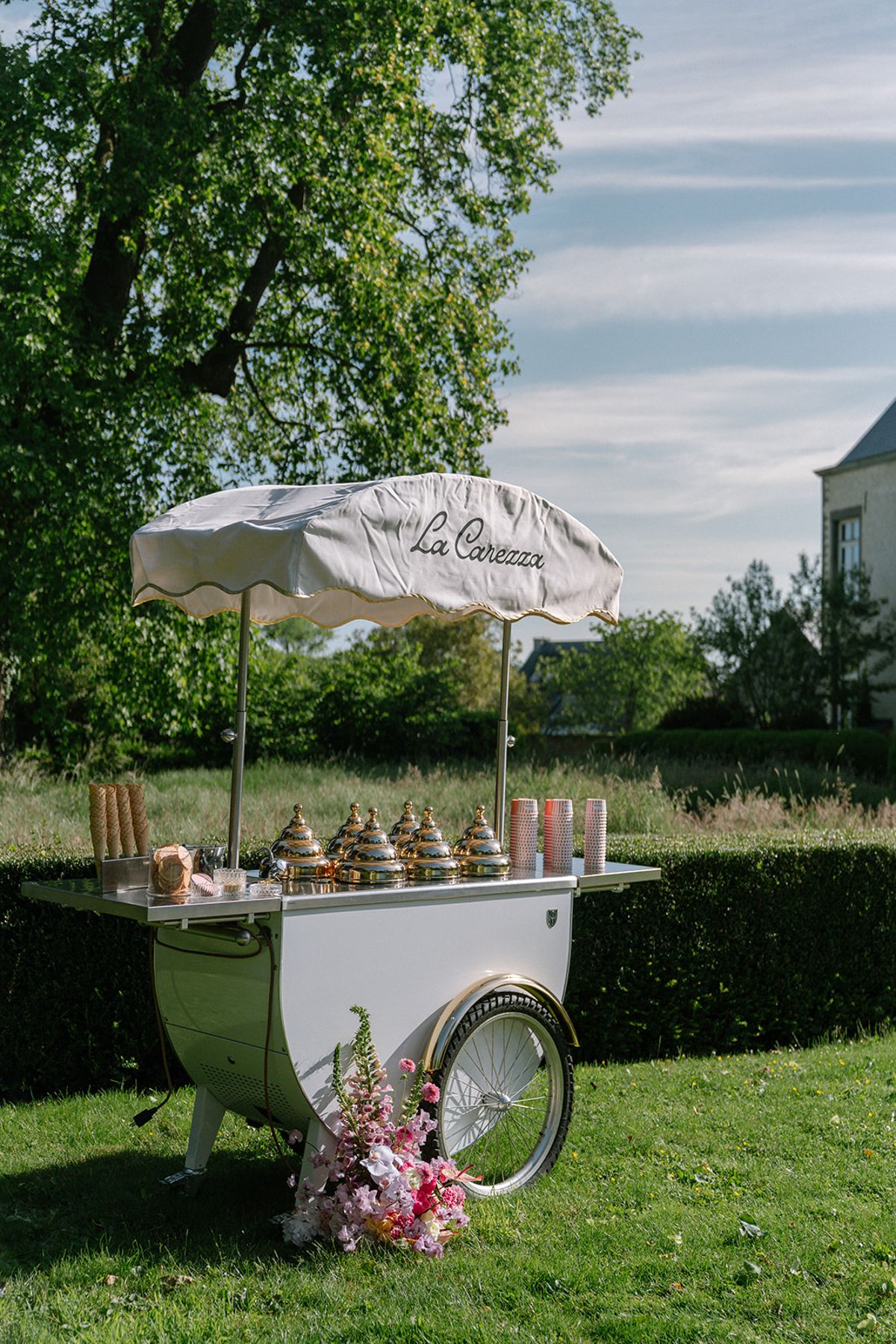 The 'La Carezza' ice cream cart beside the pool
