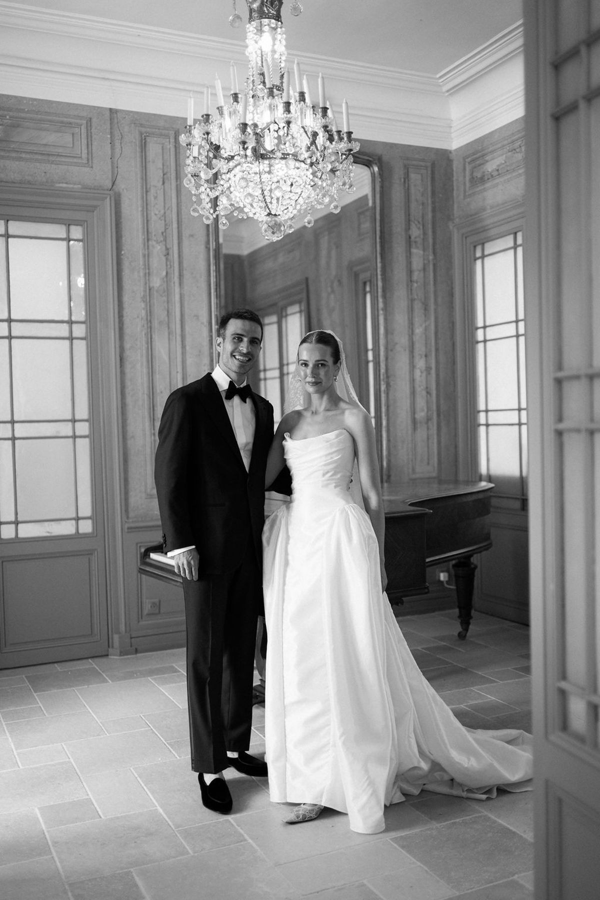 Clara and Constantin stand beside the piano inside the bastide
