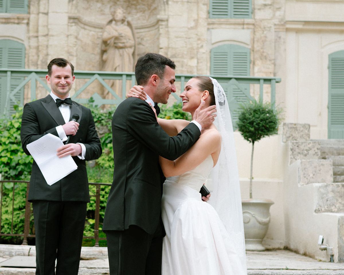Constantin holds a speech card as he and Clara share a close moment during dinner