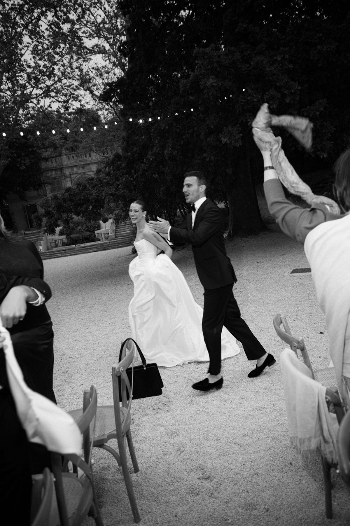 Clara and Constantin walk together, captured mid-stride in black and white