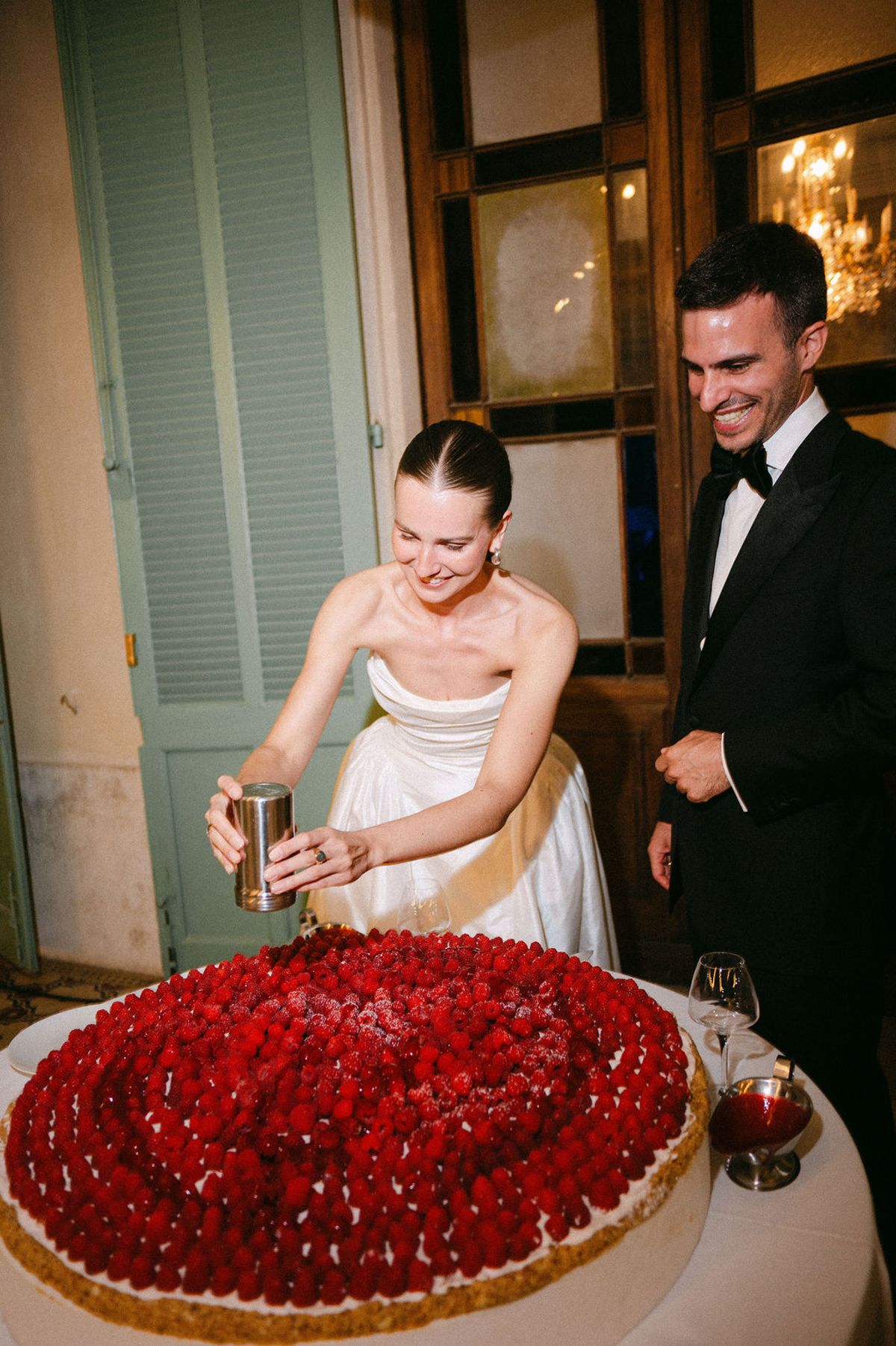 Clara opens a bottle of champagne during the celebrations