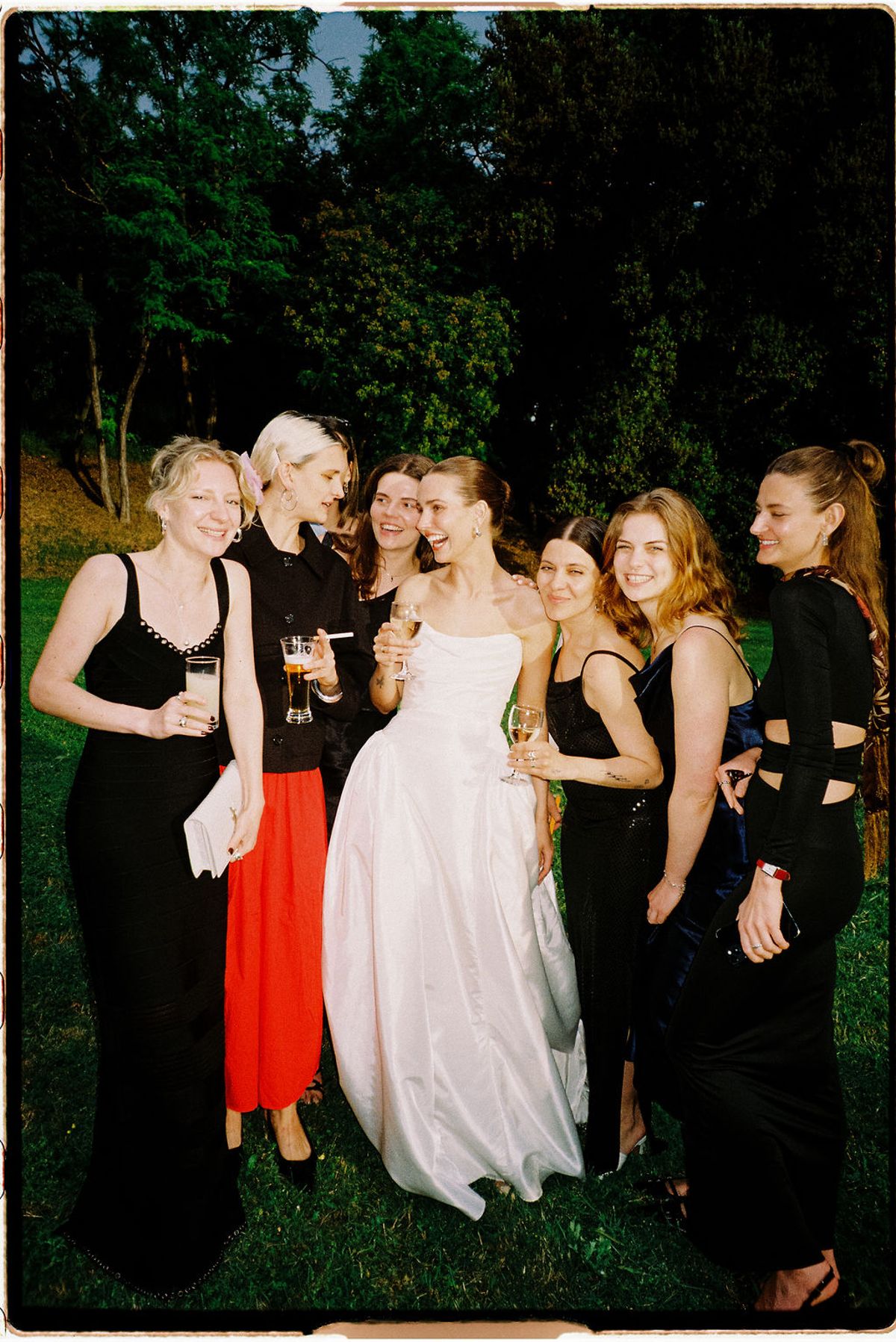 Clara and her bridesmaids gather together candidly
