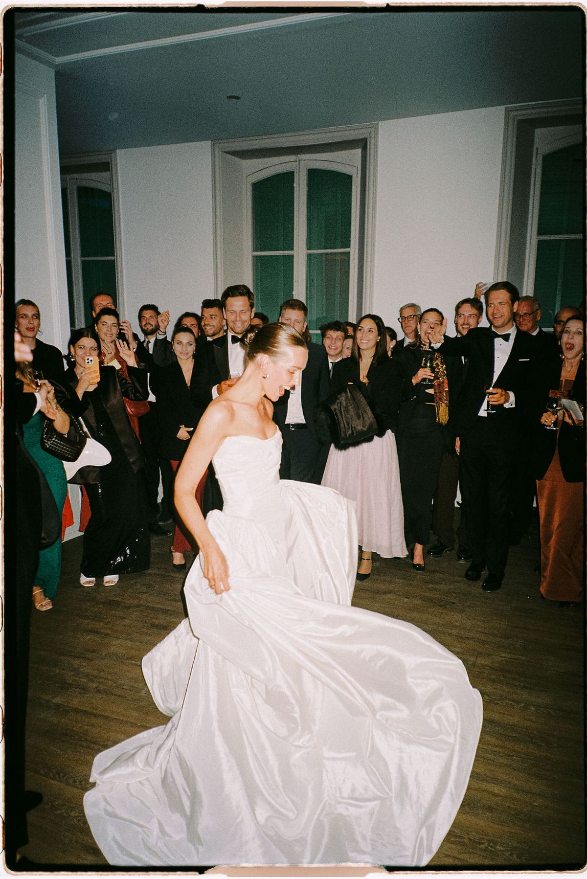 Clara dances among guests during the reception