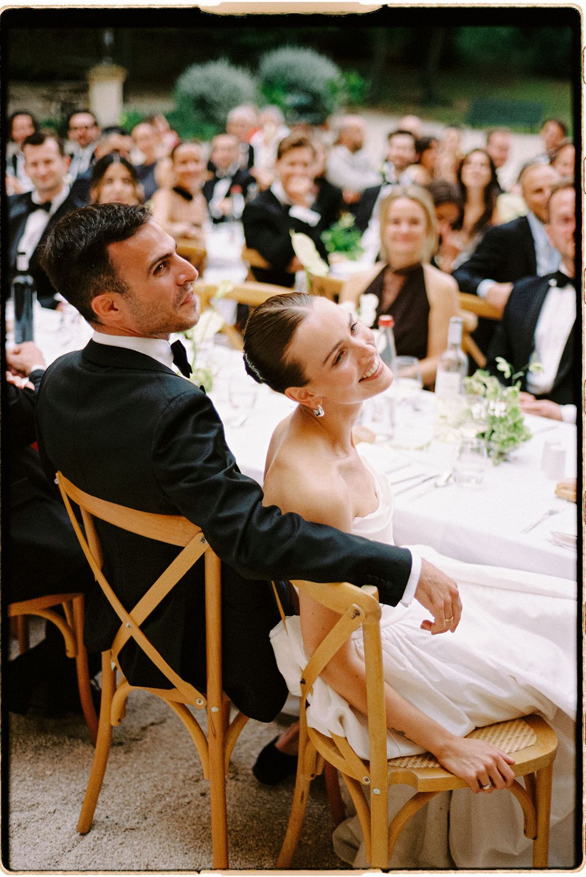 Clara and Constantin sit together at the table, smiling