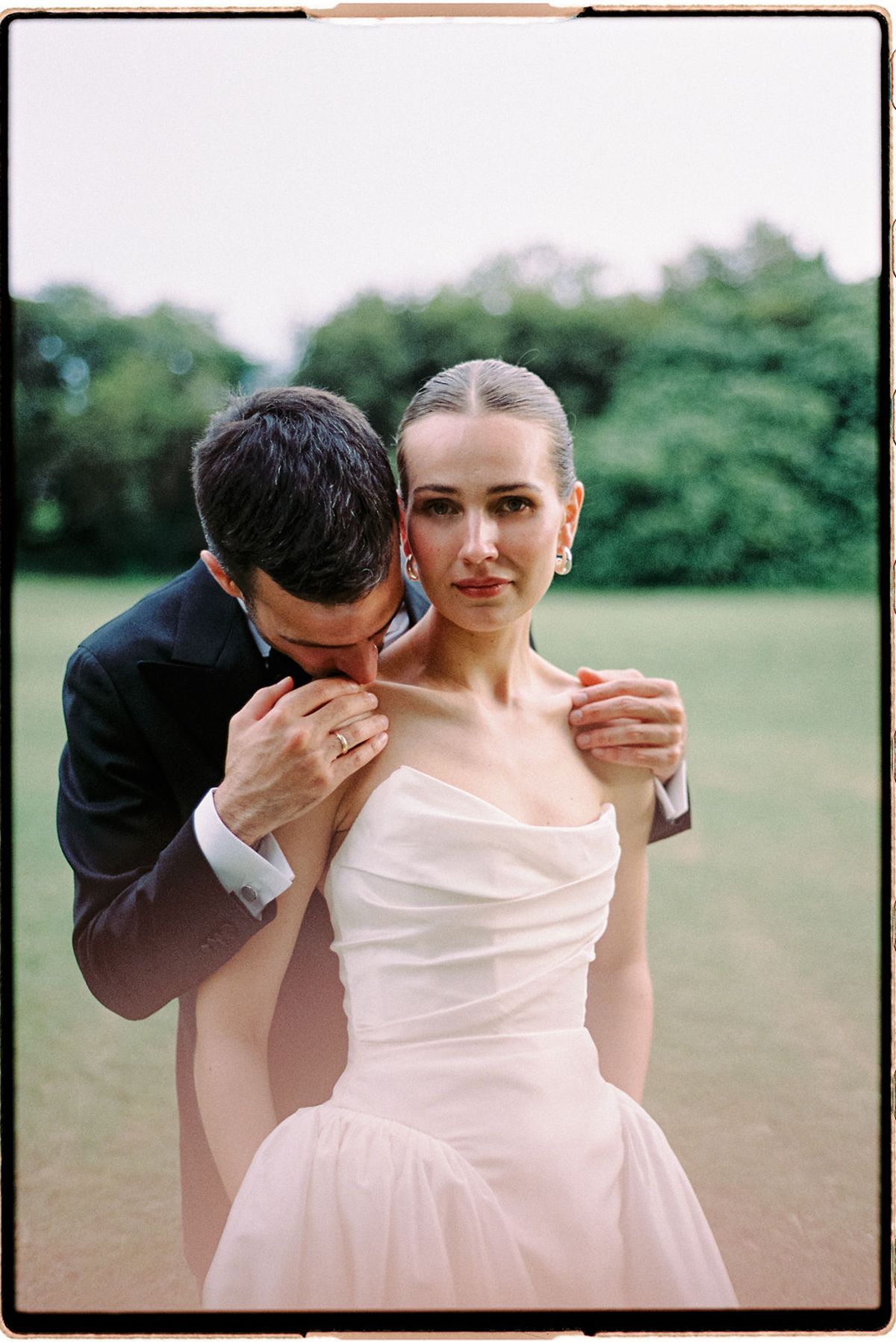Constantin holds Clara close, his face against her shoulder, in a quiet moment together