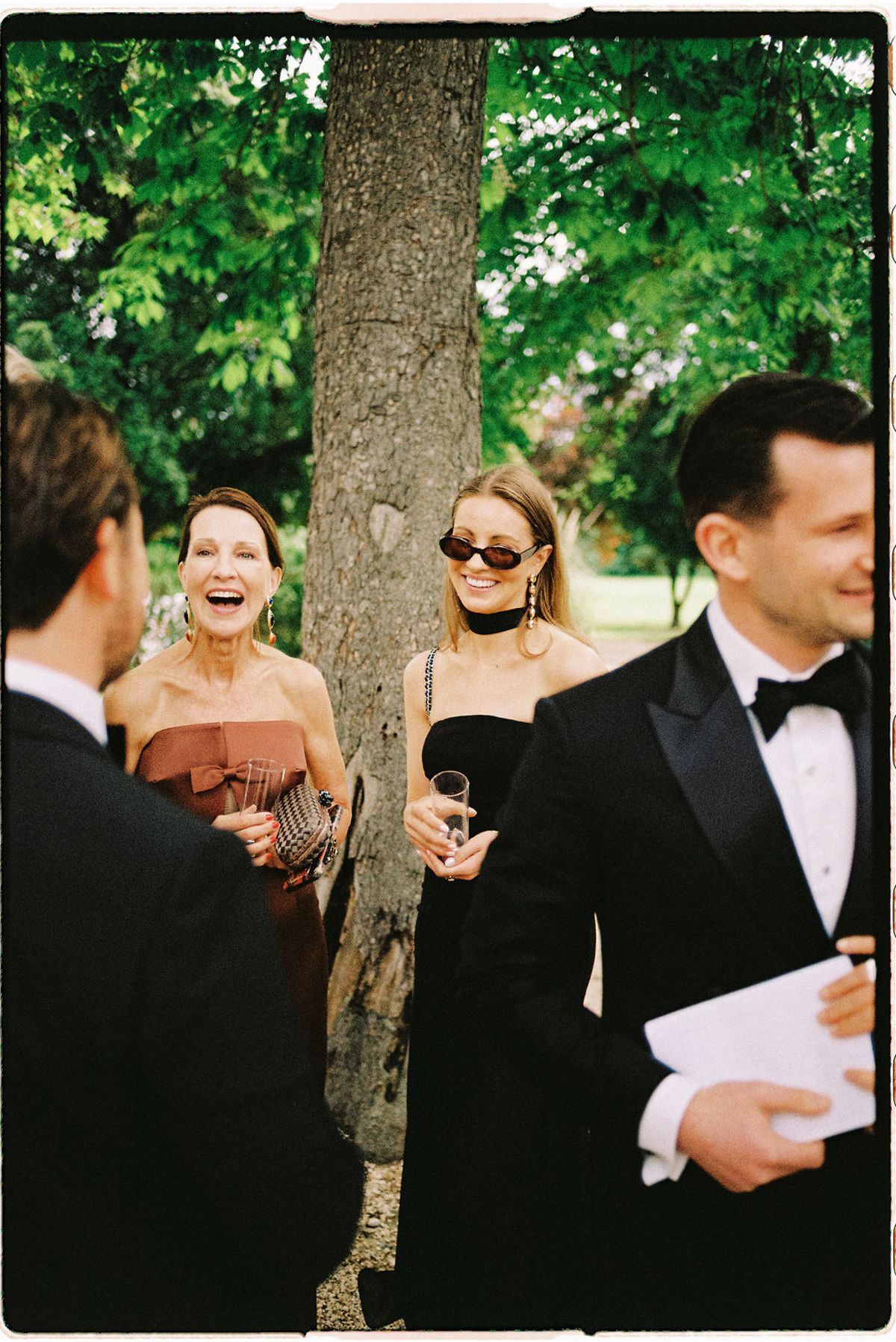 Guests laugh together during the cocktail hour