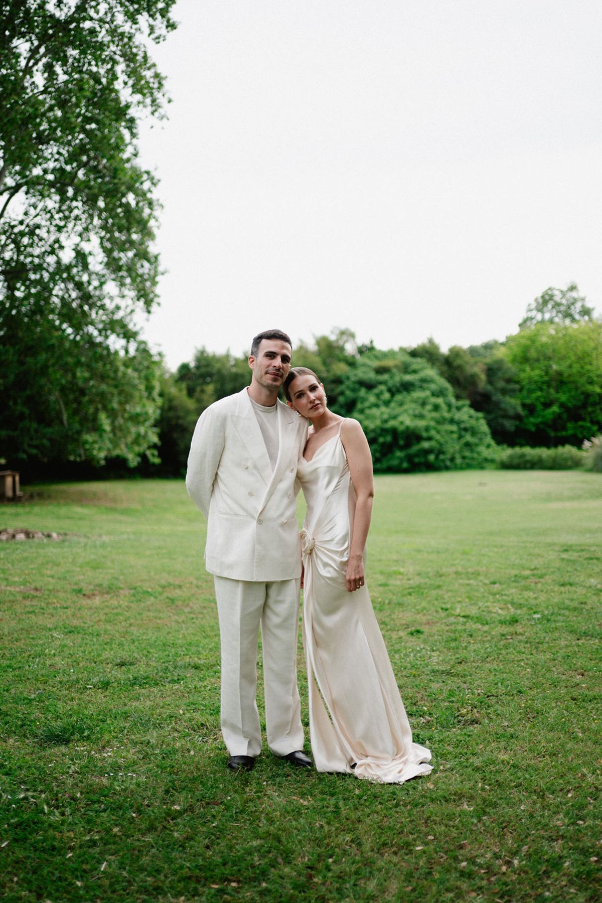 Clara and Constantin embrace on the lawn