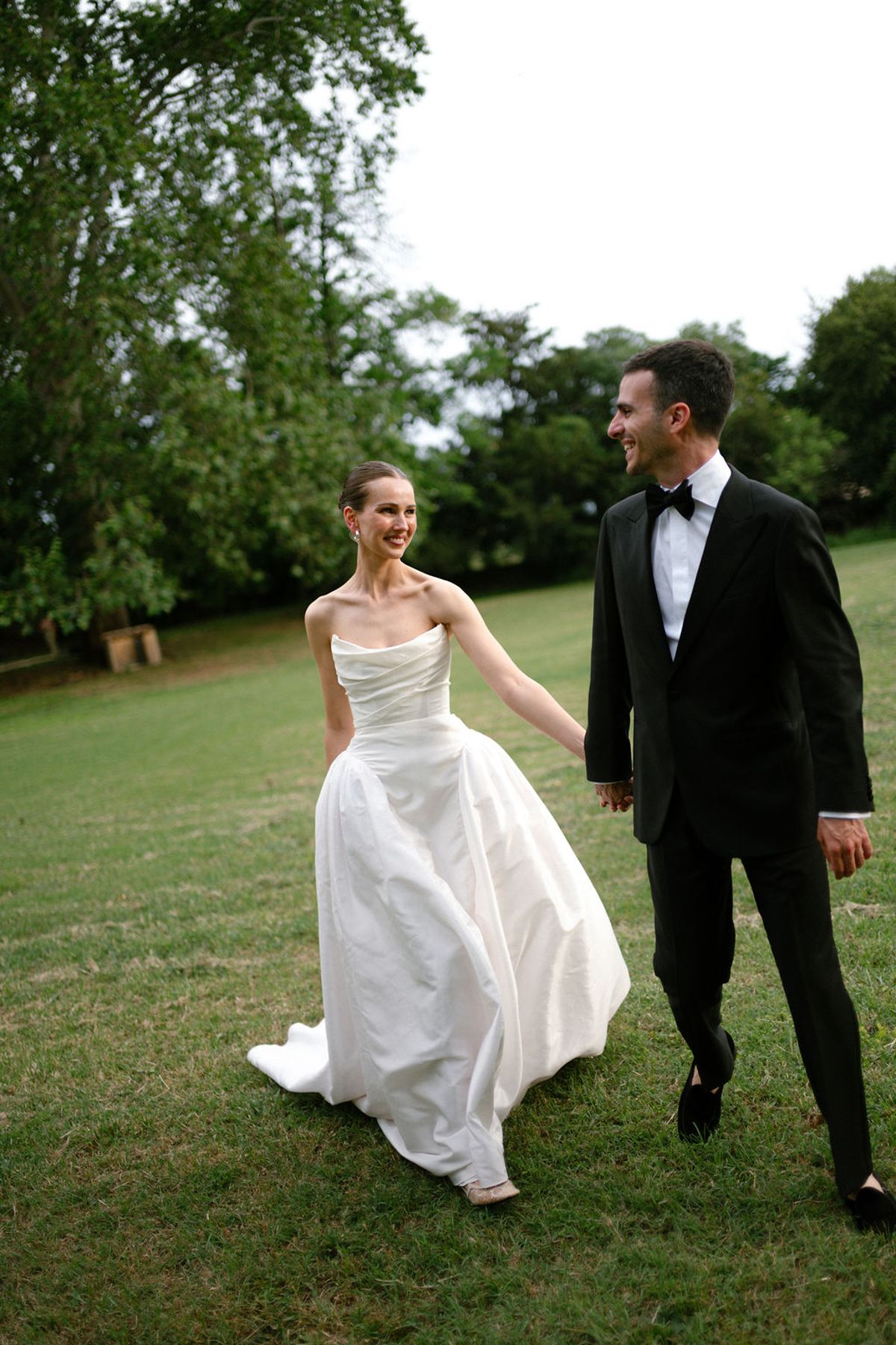 Clara and Constantin stand together on the lawn at Bastide de Toursainte