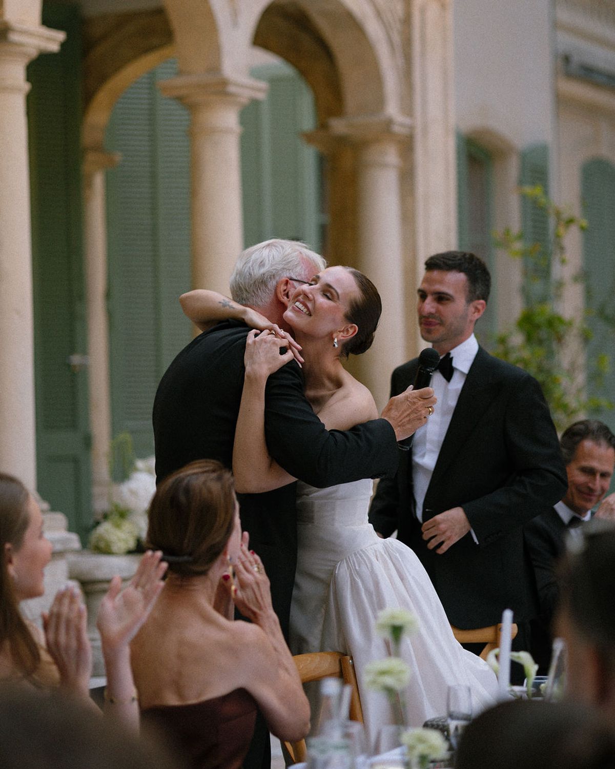 Clara's father embraces her and Constantin together