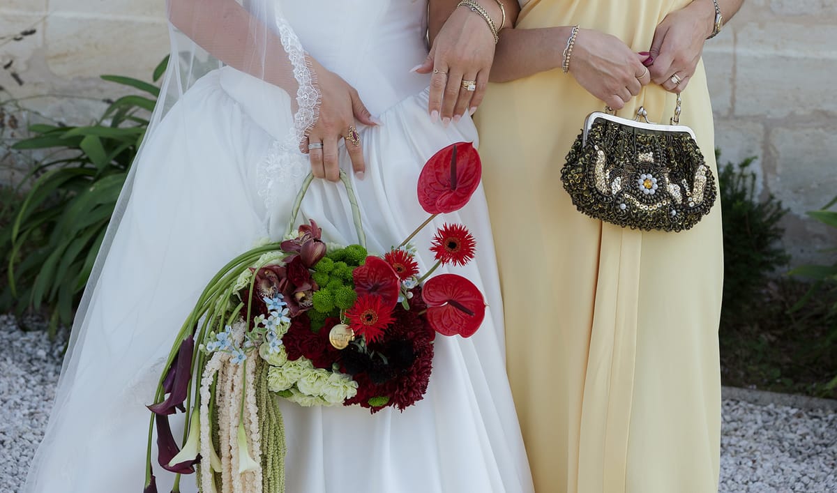 Kendra's bouquet beside a bridesmaid's beaded bag