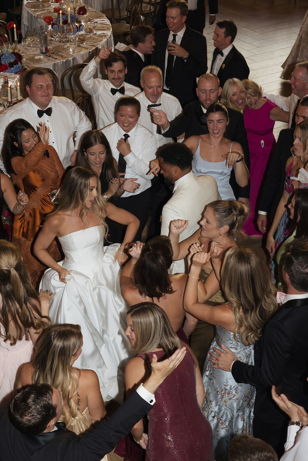 Kendra dancing in the middle of a full dance floor