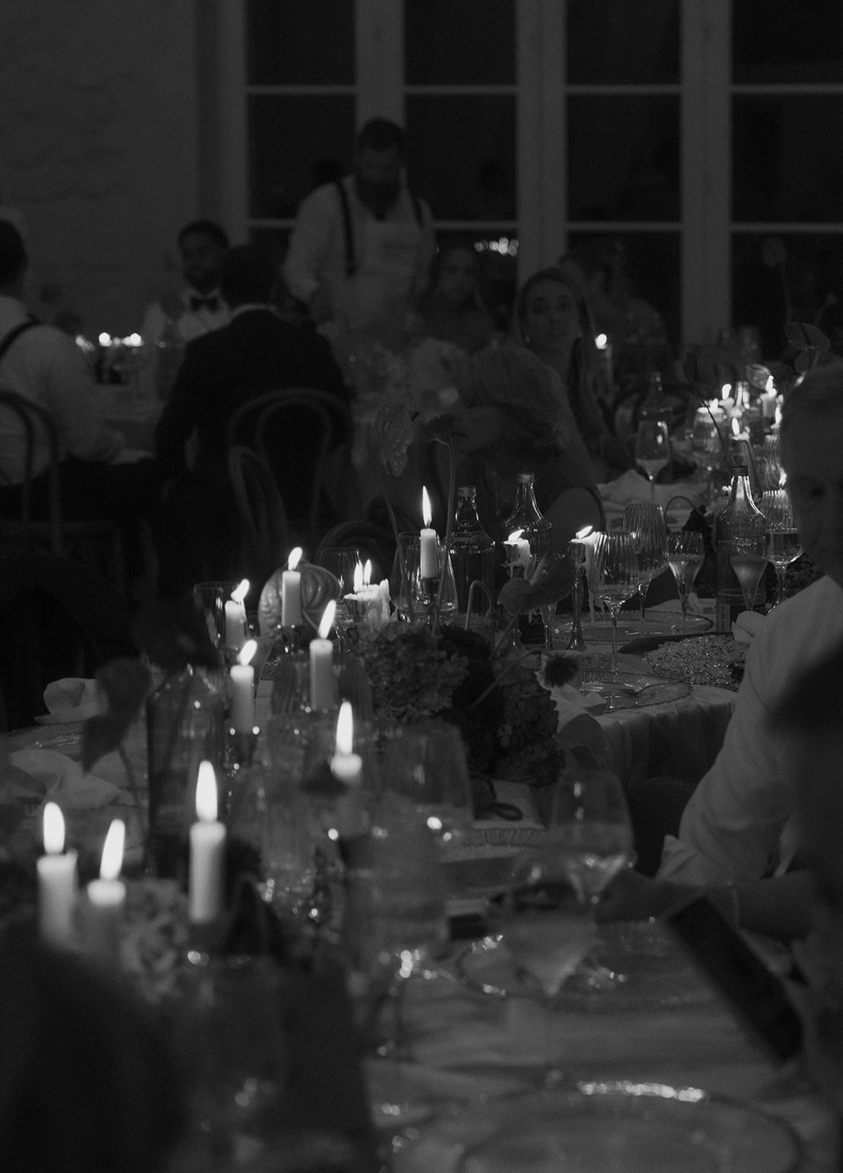 Candlelit dinner tables in the reception room