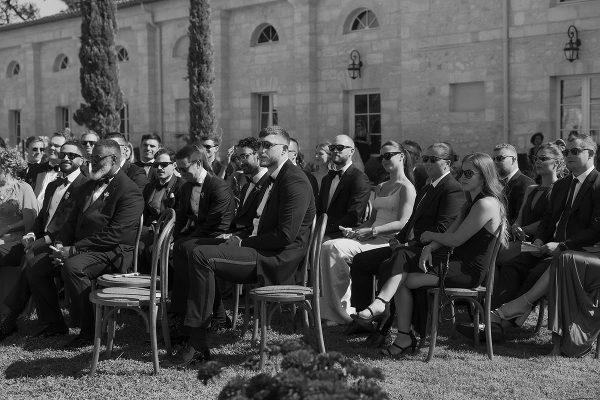 Guests seated in the ceremony rows, black and white