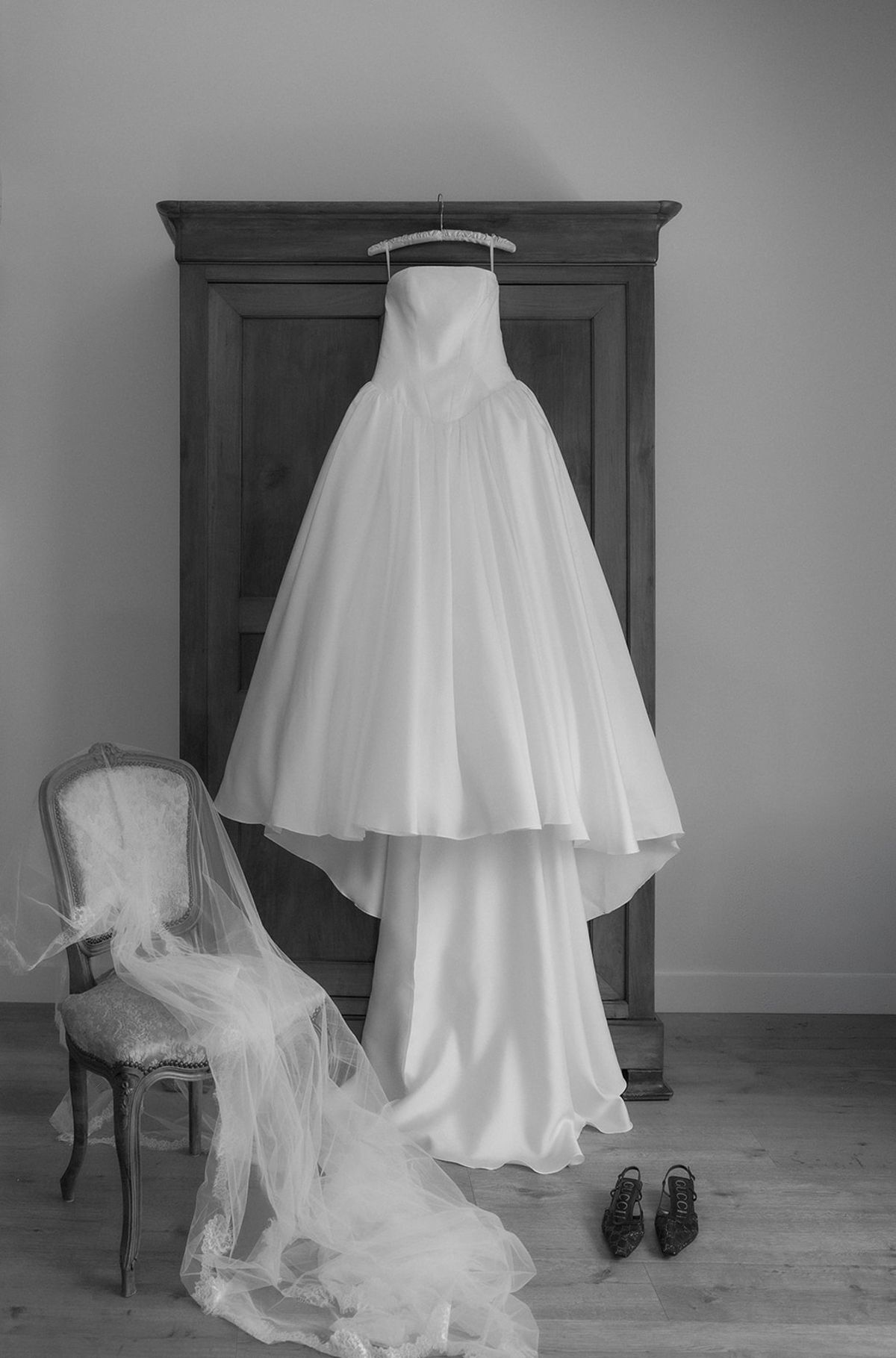 Kendra's gown hanging on an armoire, black and white