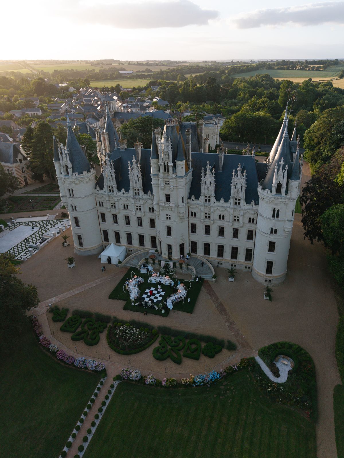 Aerial view of Chateau Challain at dusk with the reception set in the parterre