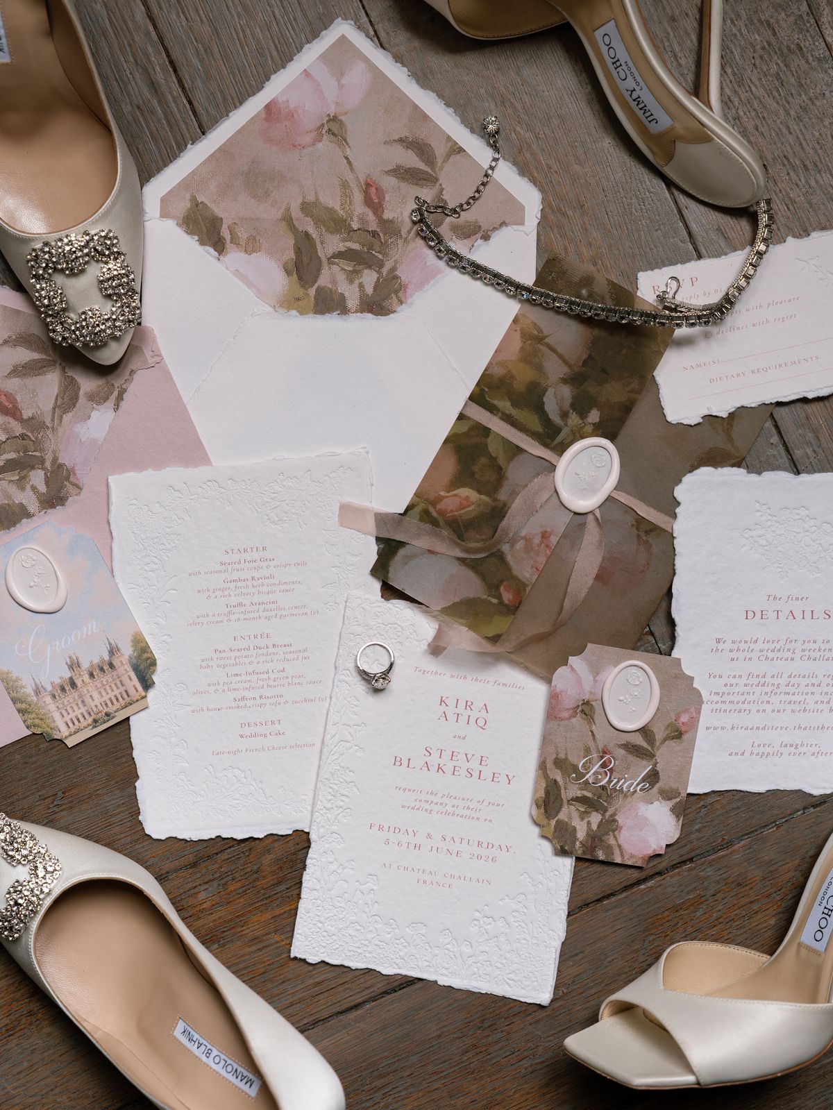 Wedding stationery for Kira and Steve with wax seals, rings and satin bridal heels on a wooden floor
