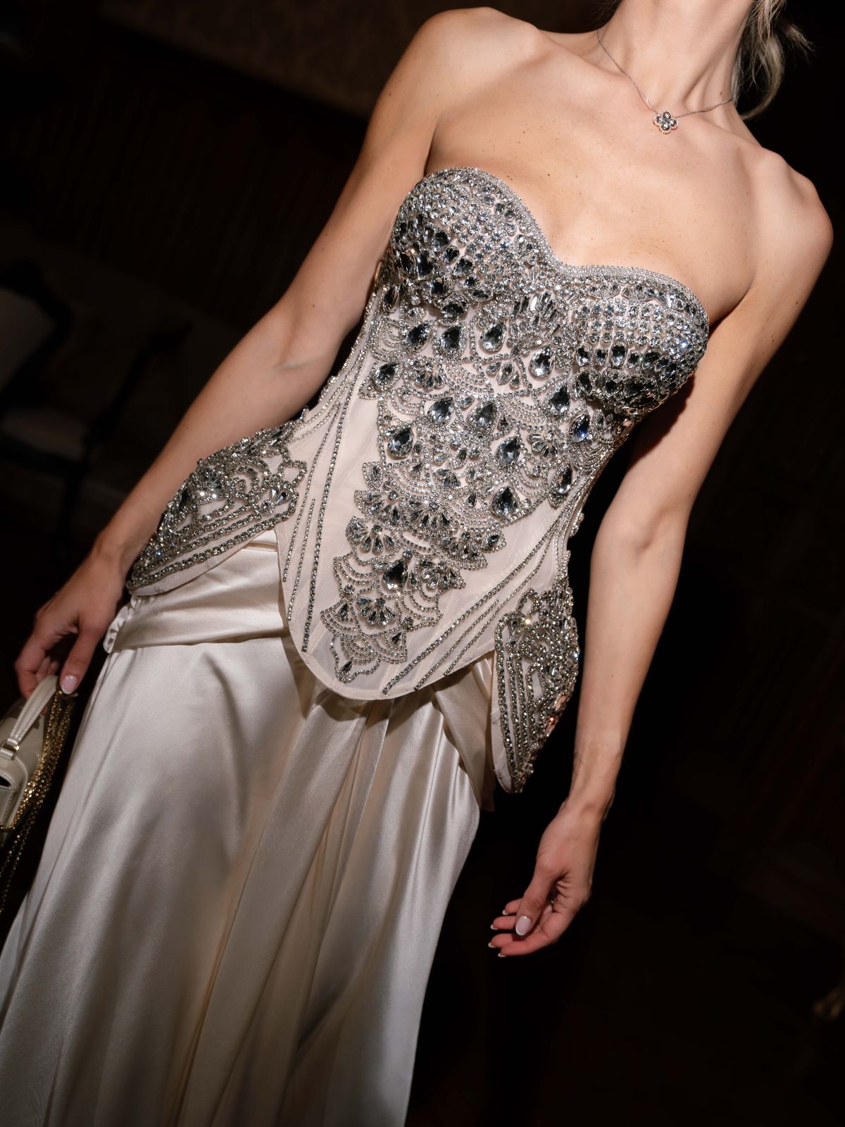 Close-up of Kira's crystal-embellished corset and silk skirt for the evening