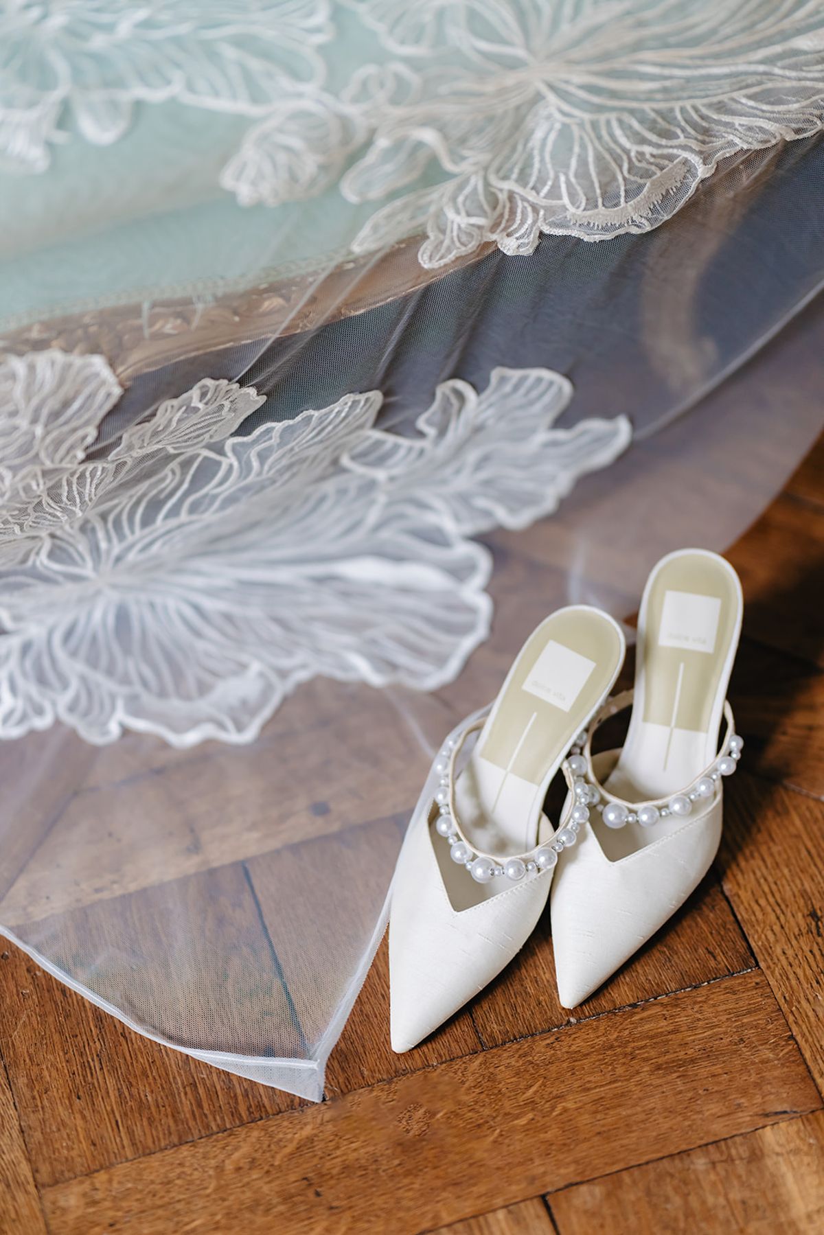 Bridal veil and shoes styled together as a detail flat lay