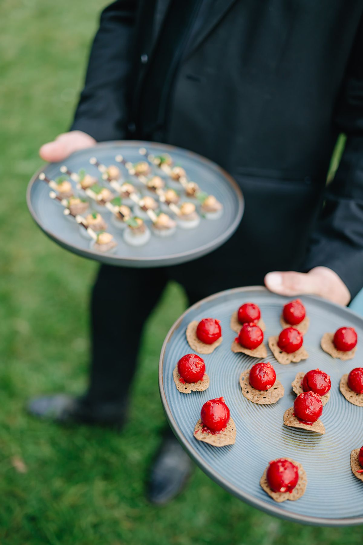 A tray of canapés being served during cocktail hour