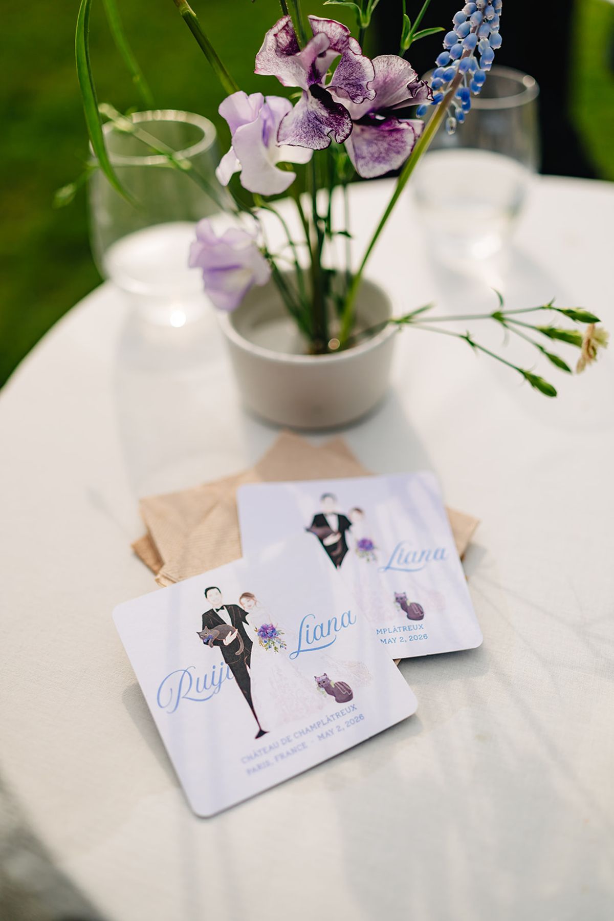 Place-card illustration and flowers on the welcome table