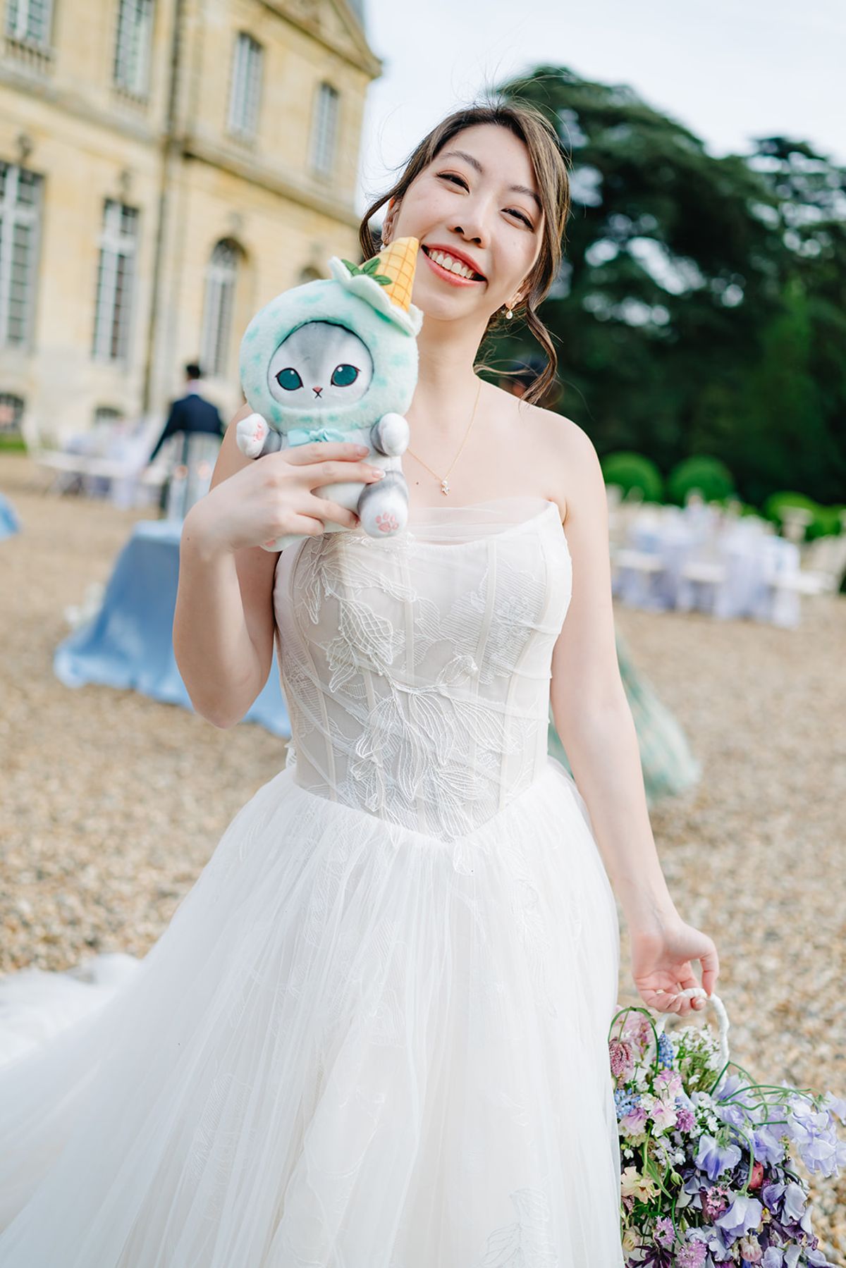 Liana holding a small plush owl keepsake, close portrait