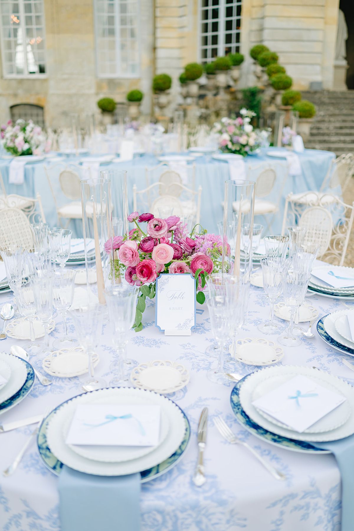 Pink floral centrepiece on a reception table