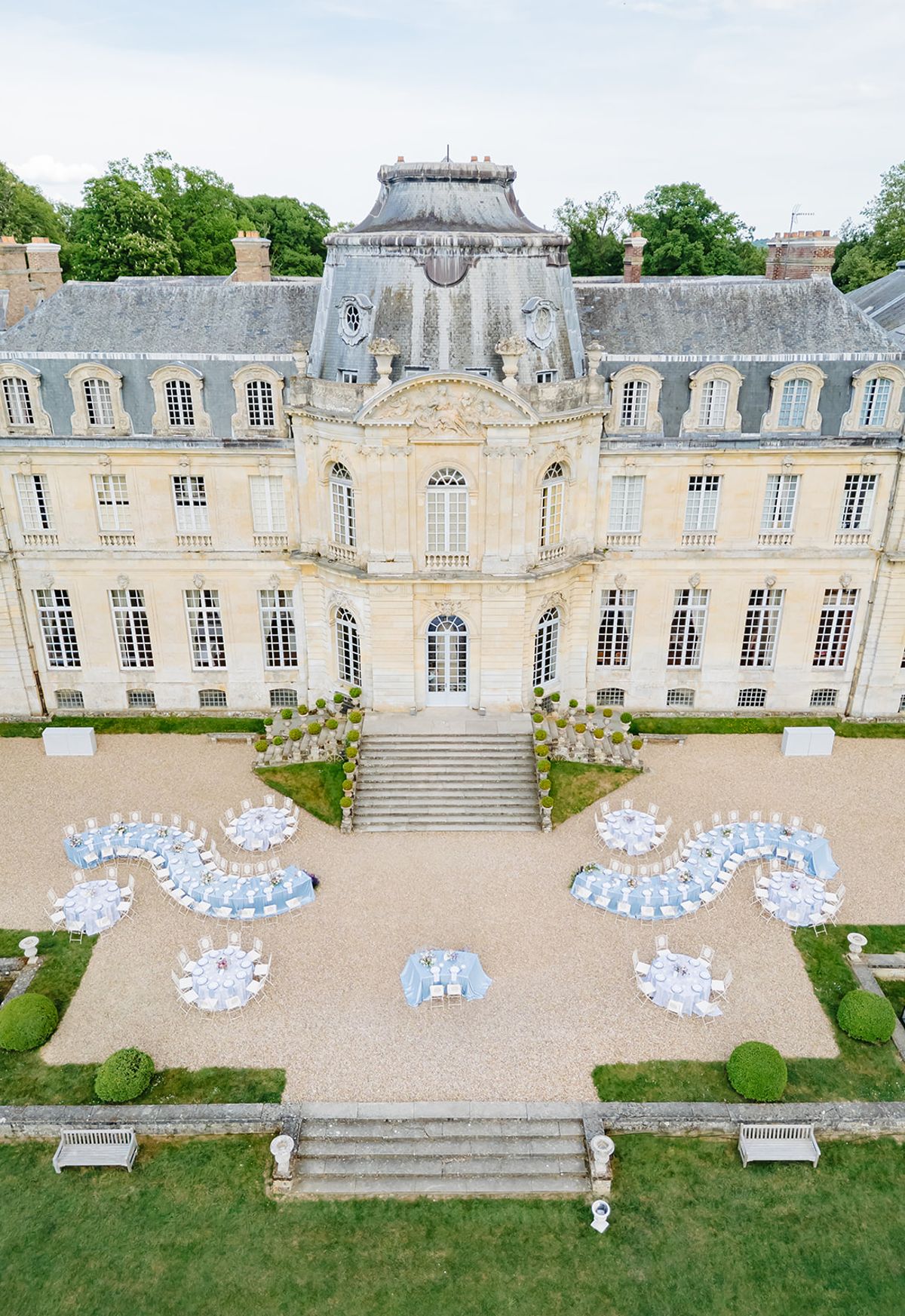 Aerial view of the ceremony aisle and gardens leading up to Château de Champlâtreux