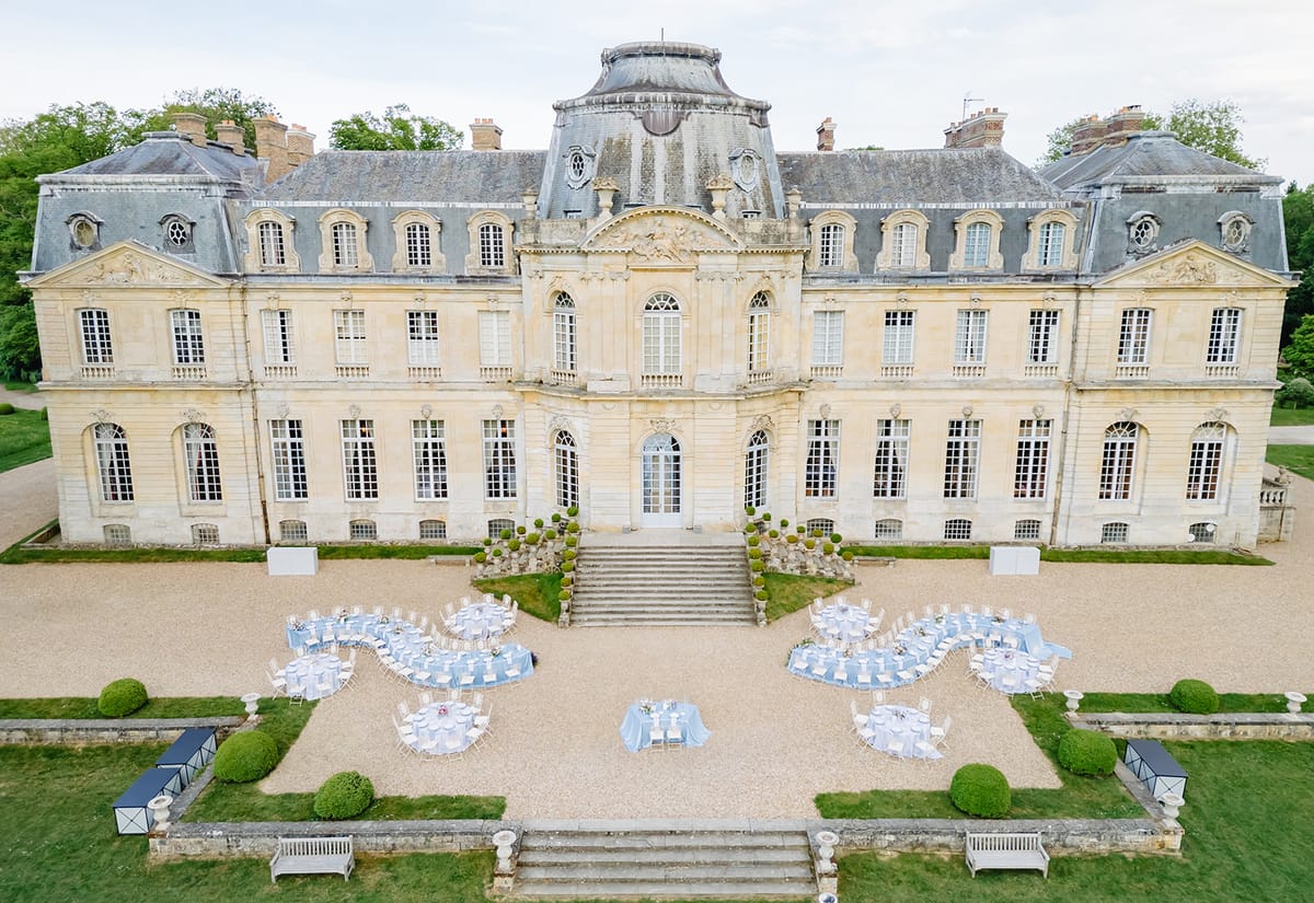 Aerial view of the empty reception tables set in front of Château de Champlâtreux