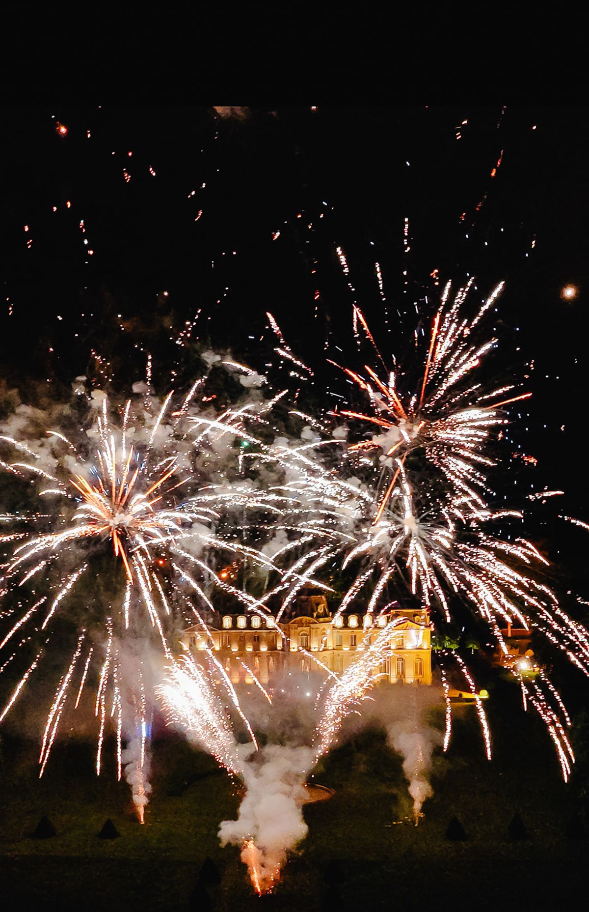 Fireworks over Château de Champlâtreux during the evening reception