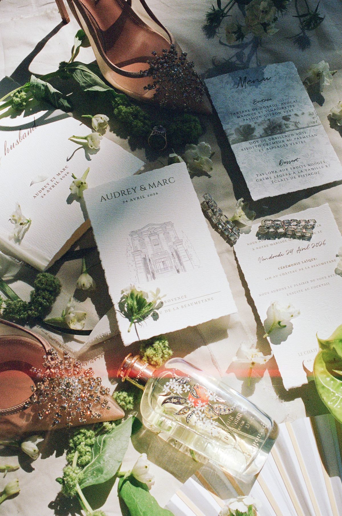 Menu card for Audrey & Marc styled with white florals, shot on film