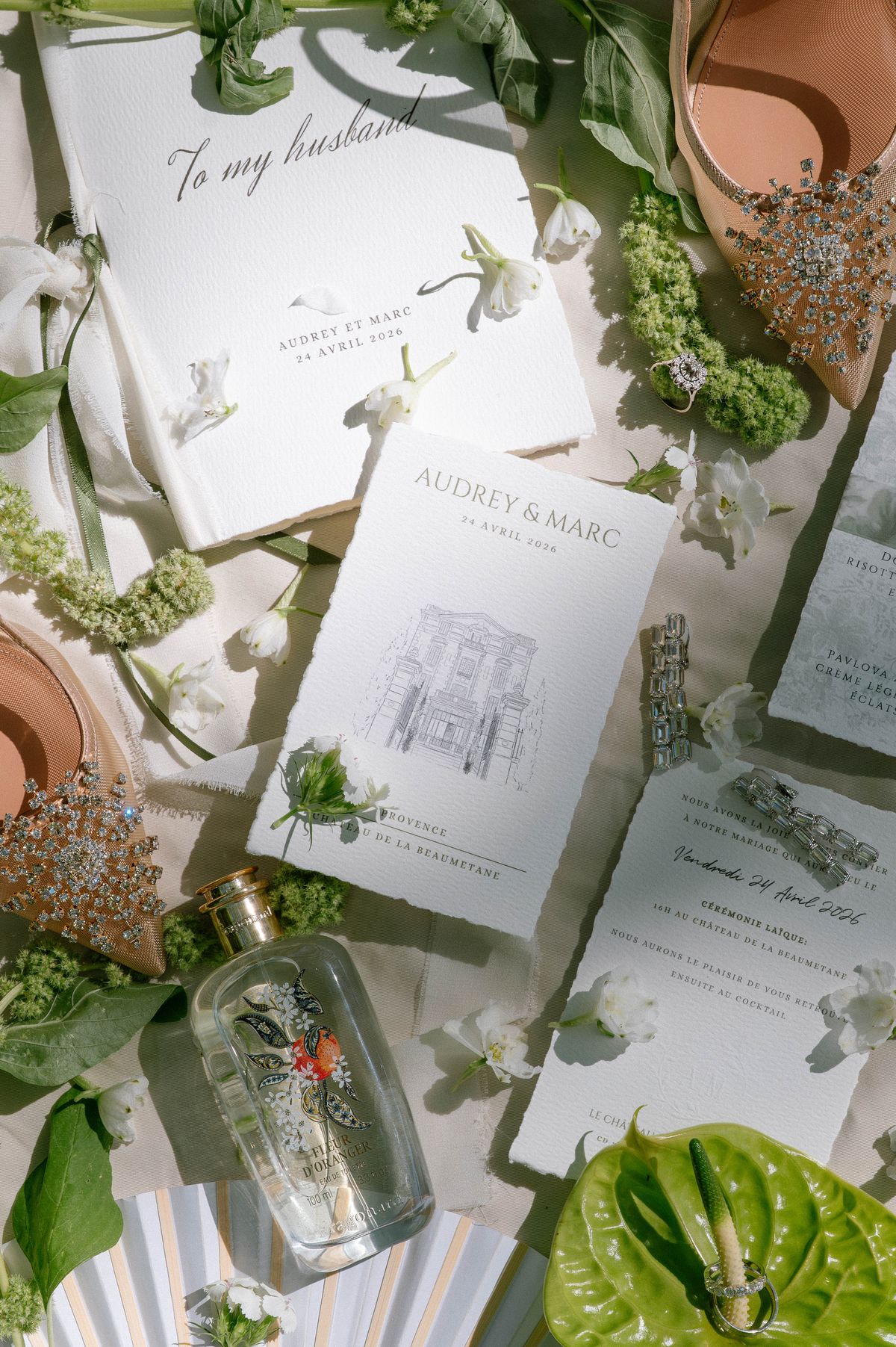 Wedding invitation suite for Audrey & Marc styled among white florals