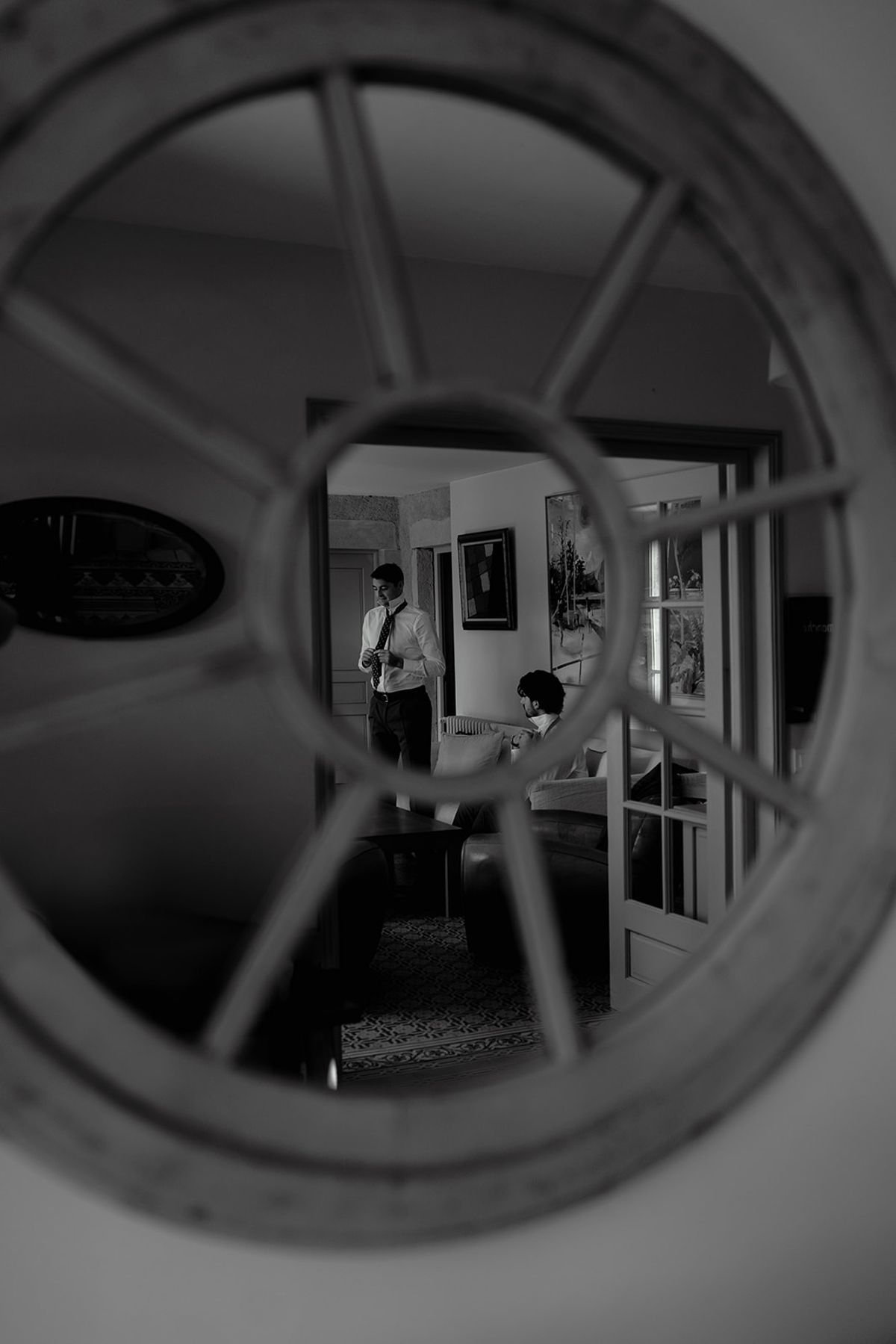 A reflected view through a round window as the morning begins