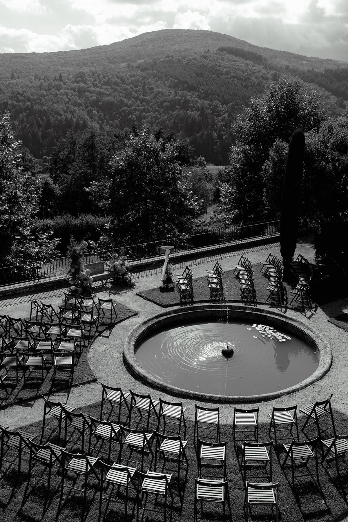 The circular pool and ceremony seating in black and white