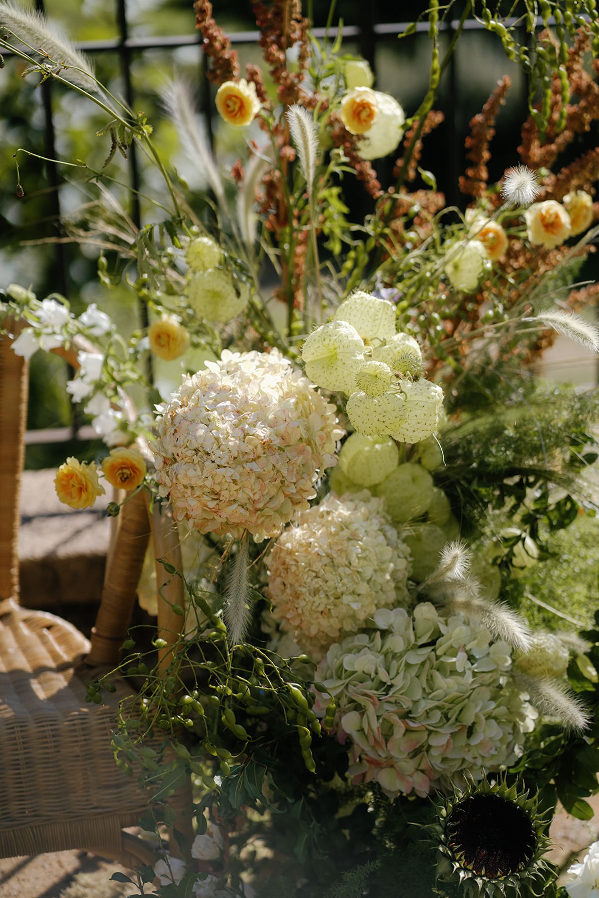 A close view of hydrangea, craspedia and seasonal blooms