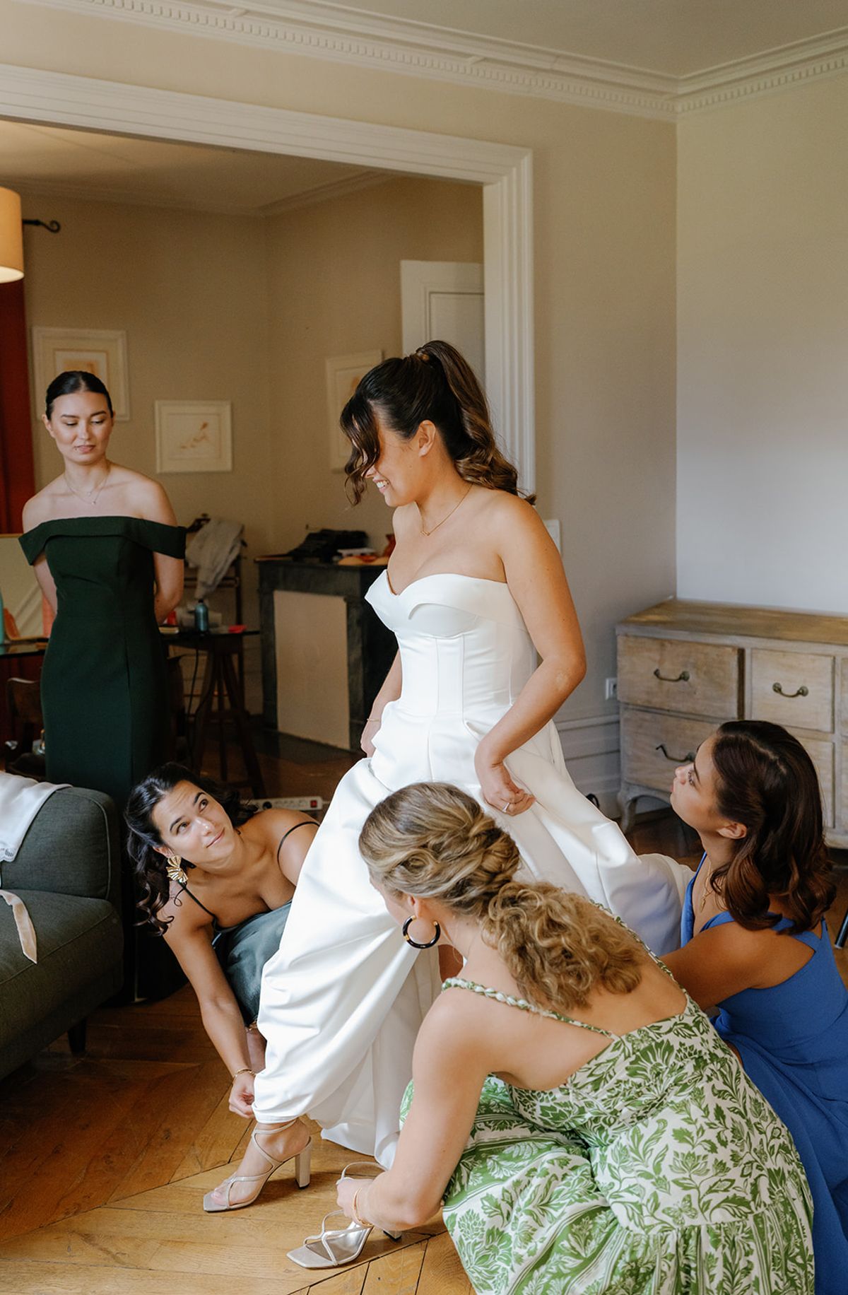 Final adjustments to the bride's dress before the ceremony