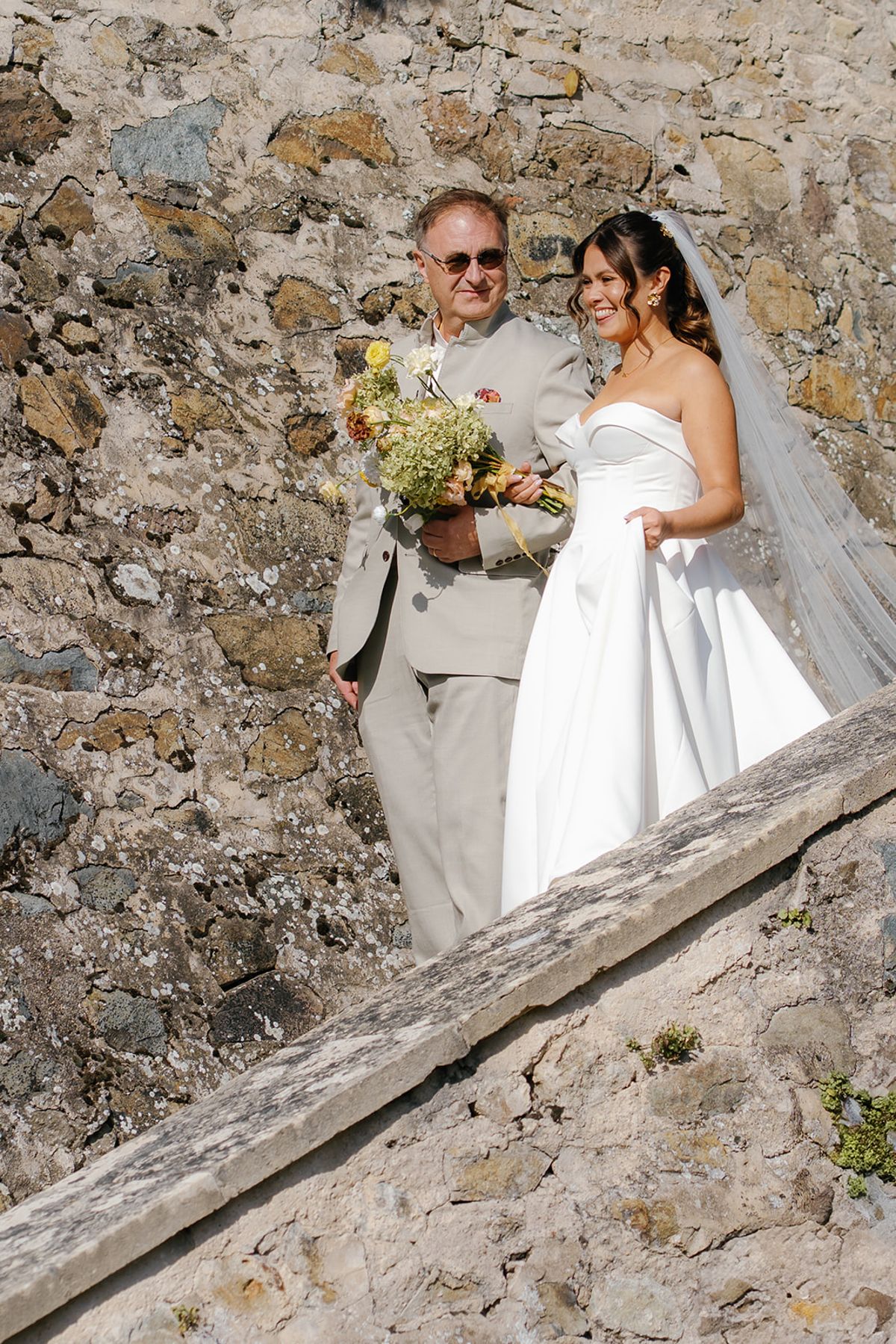 The bride and her father on the steps before the ceremony