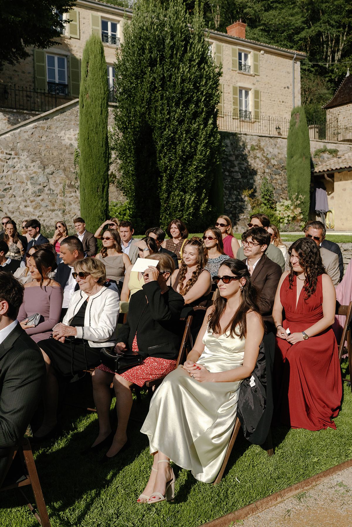 Friends and family seated on the lawn for the ceremony