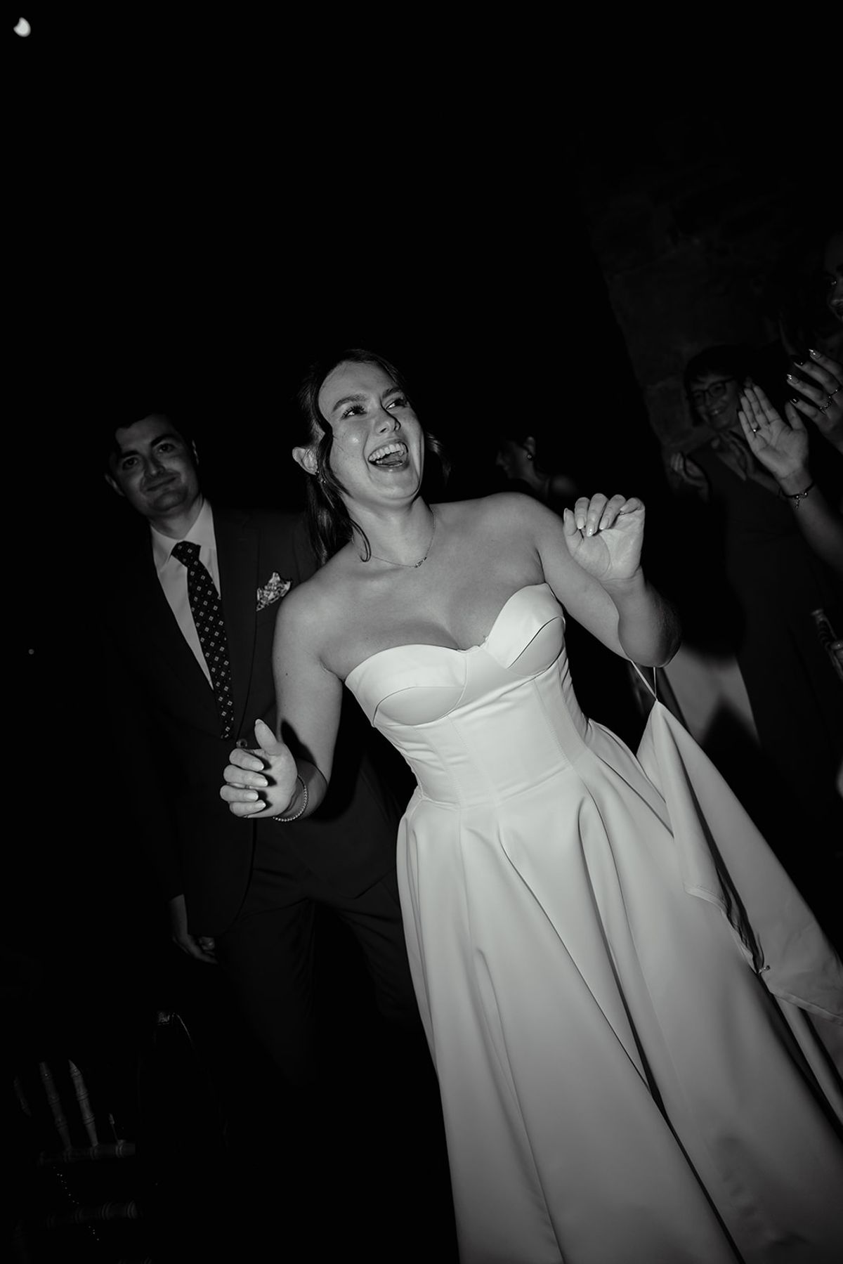 The bride dancing in black and white